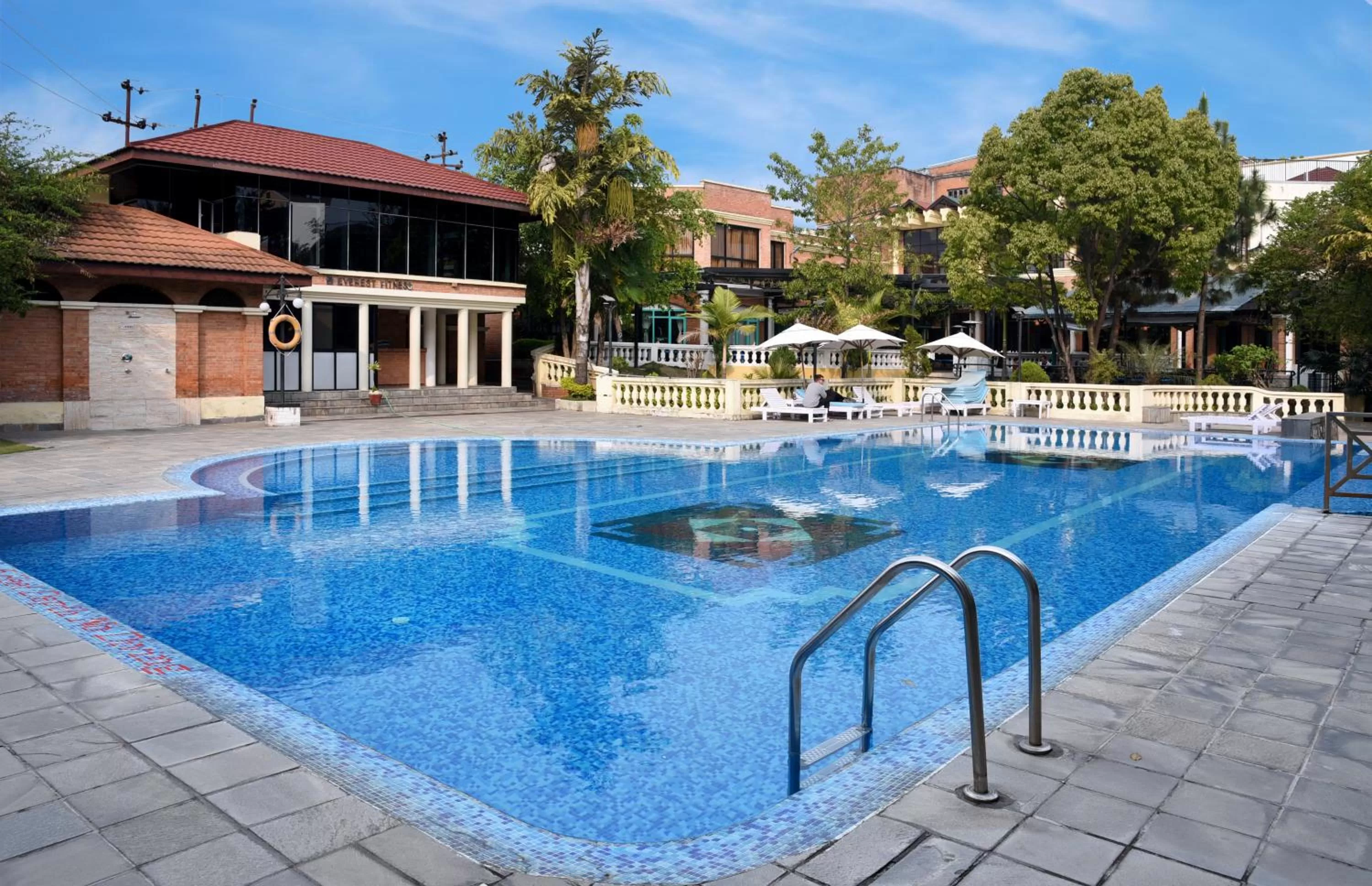 Swimming pool in Park Village Resort by KGH Group
