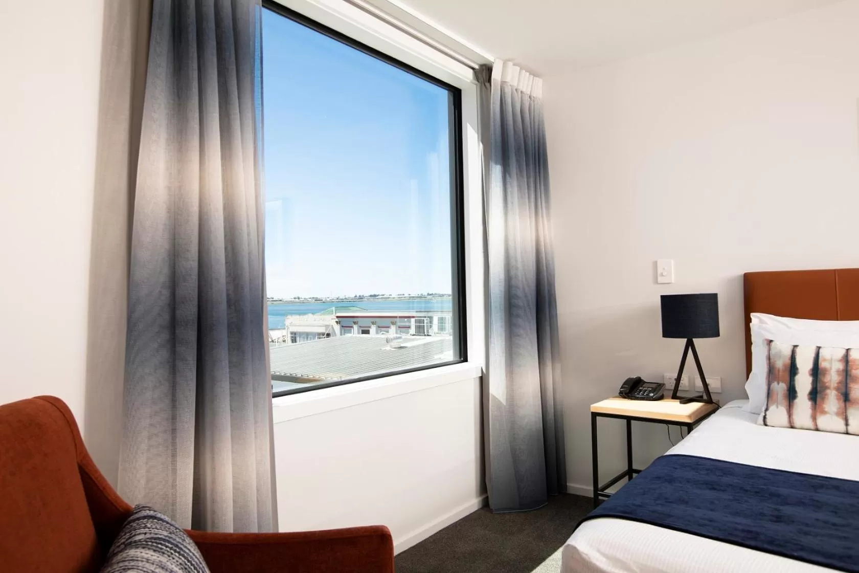 Bed in Quest Tauranga Central