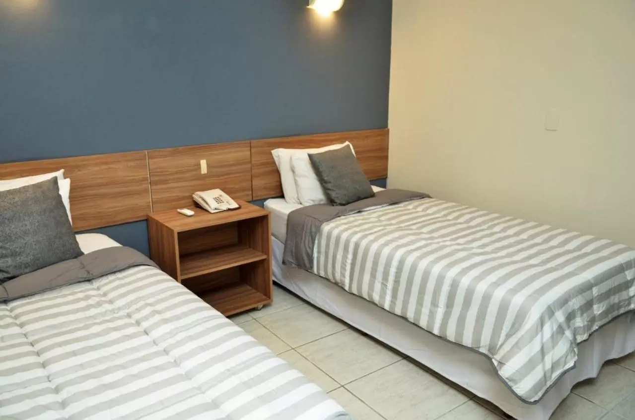 Photo of the whole room, Bed in Embaixador Hotel & Centro de Eventos by Fast10