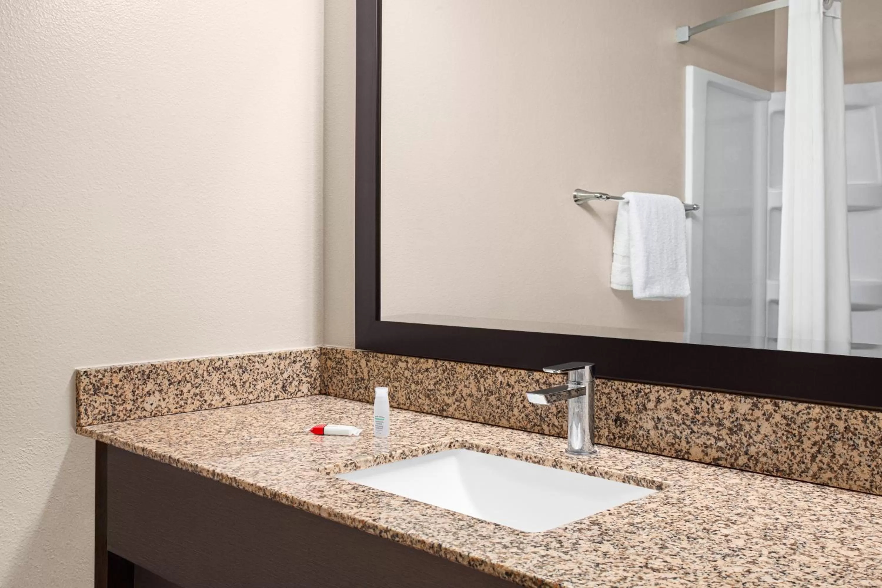 Bathroom in Super 8 by Wyndham Lenexa Overland Park Area/Mall Area