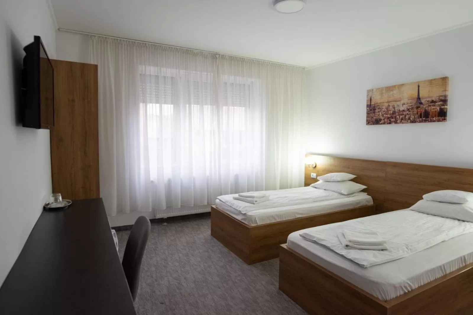 Bed in Carnival City Hotel Oradea