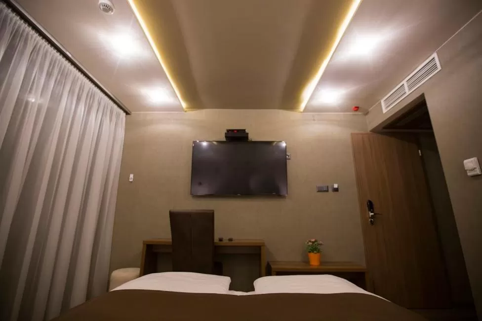 Photo of the whole room, TV/Entertainment Center in Pole Position Beach Hotel