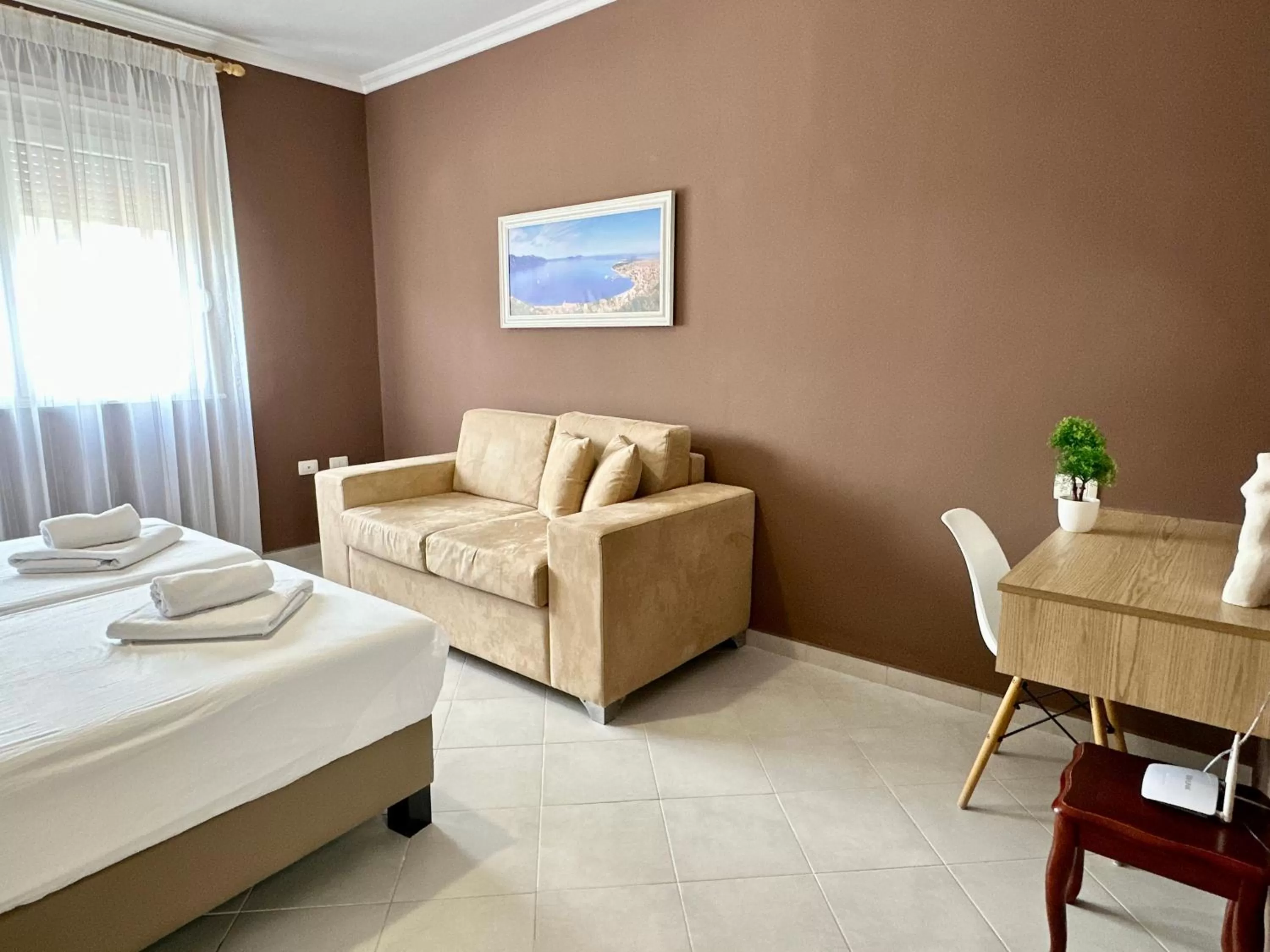 Bed, Seating Area in FAMILY SUITE RESIDENCE