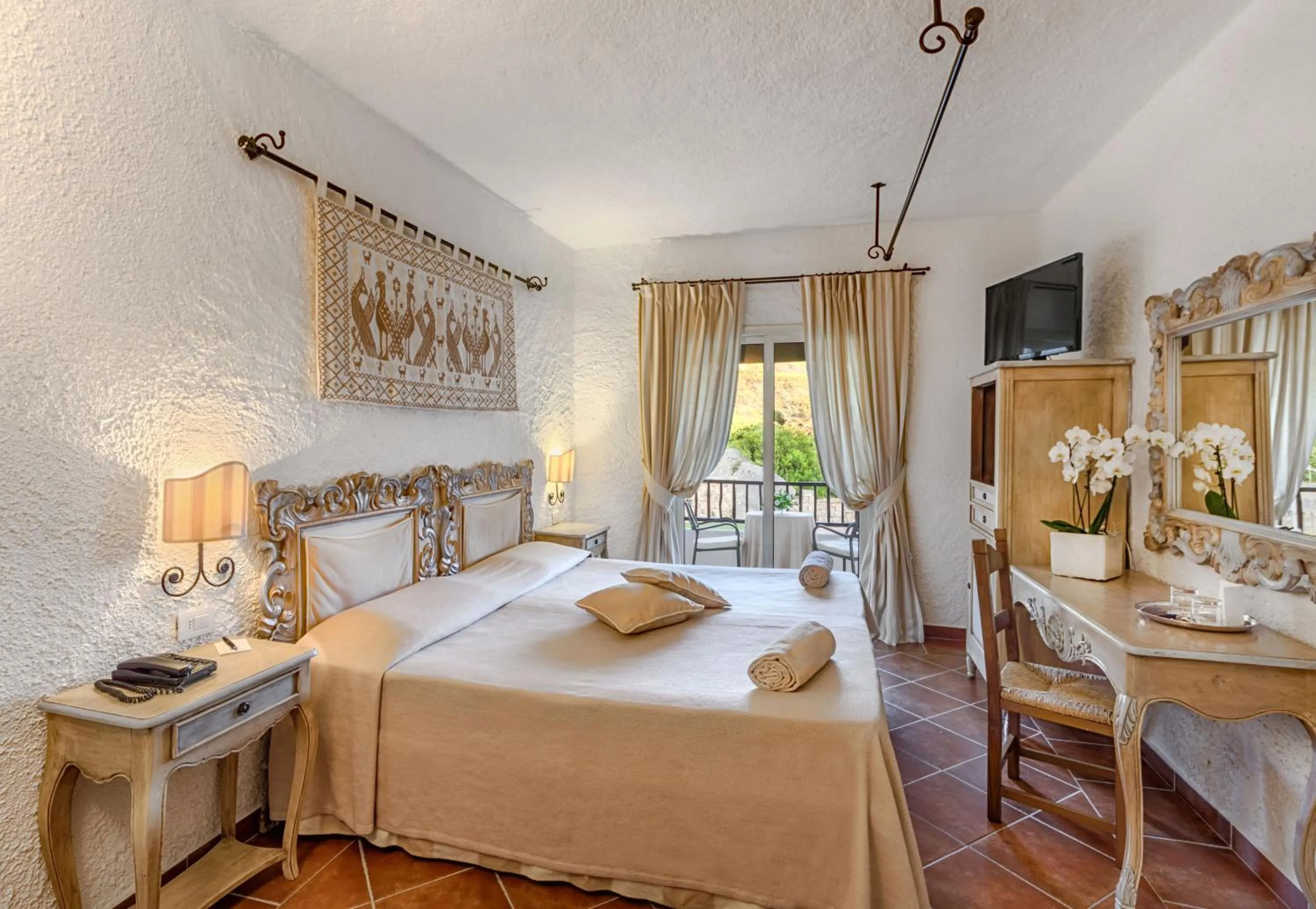 Photo of the whole room, Bed in COLONNA GRAND HOTEL CAPO TESTA, a Colonna Luxury Beach Hotel, Santa Teresa Sardegna