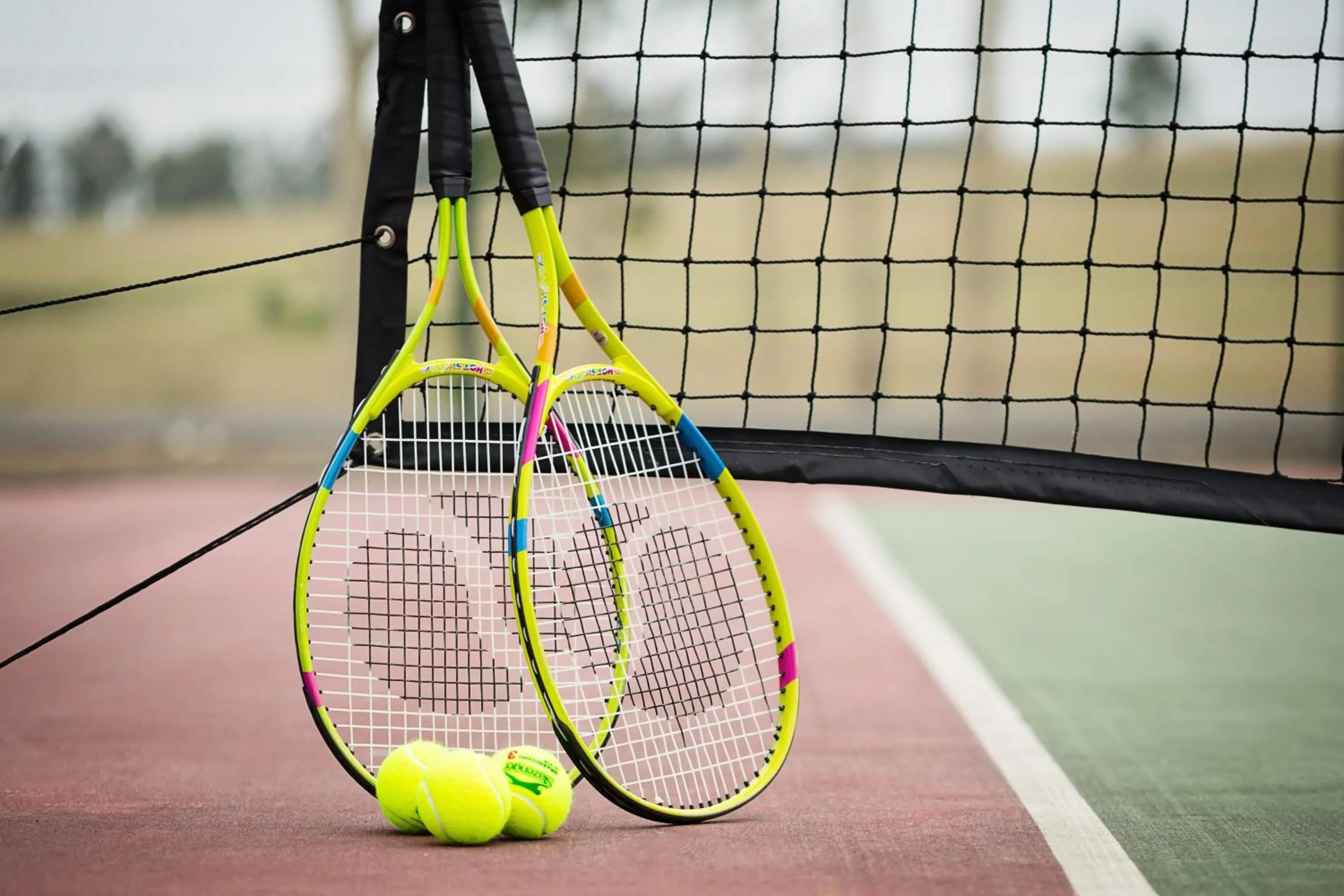 Tennis court in Pokolbin Village Estate
