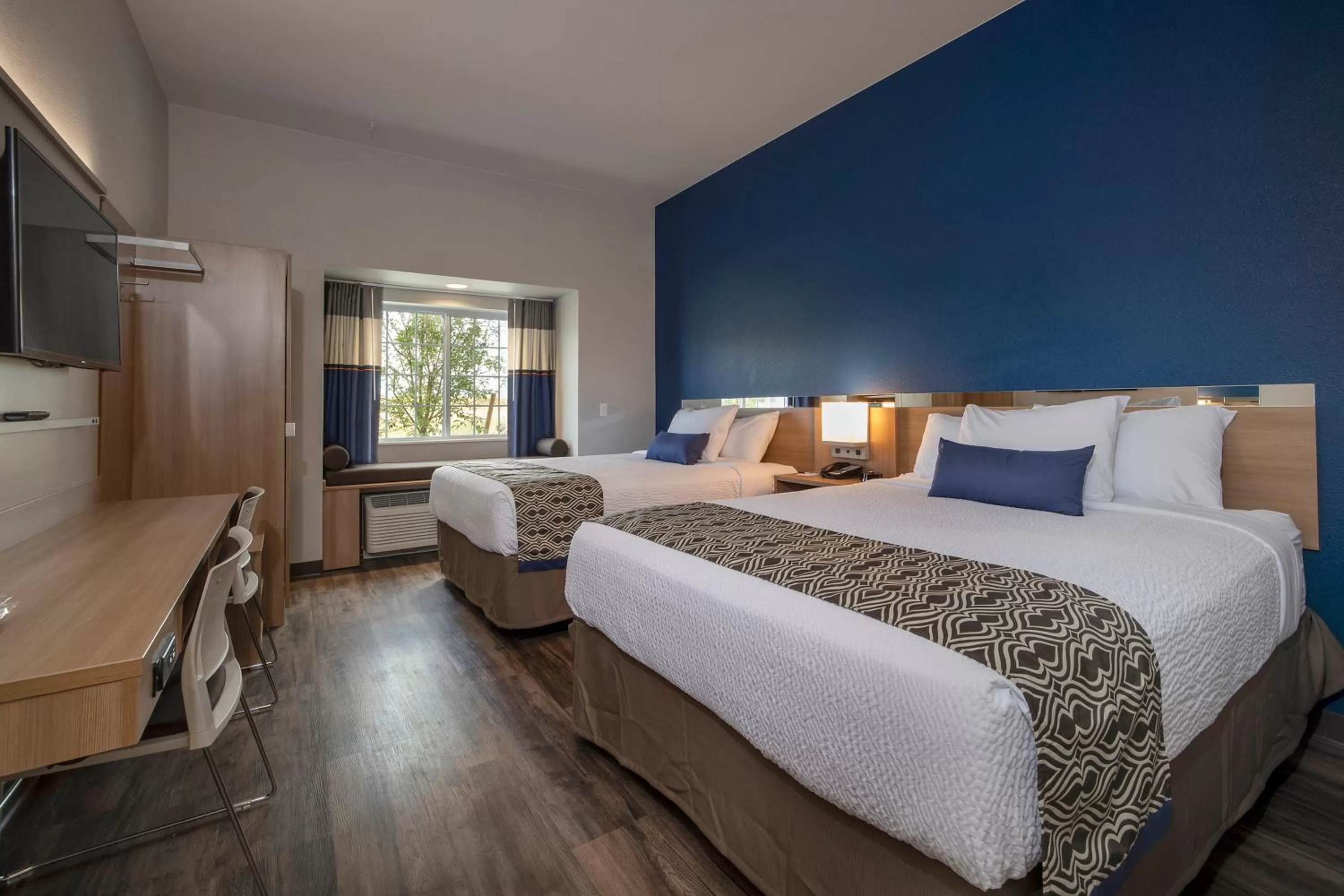 Bed in Microtel Inn & Suites by Wyndham Loveland