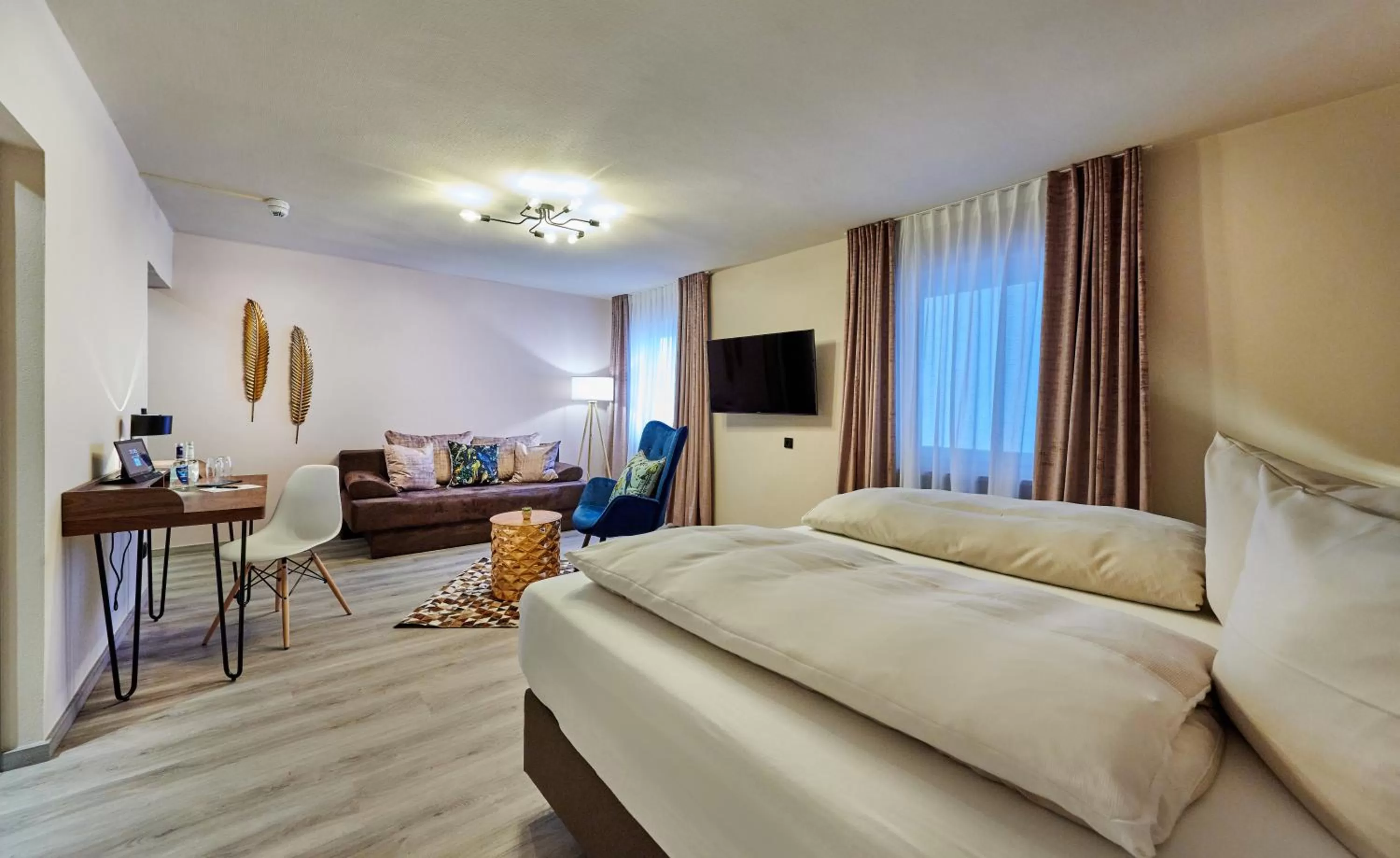 Photo of the whole room, Bed in Genusshotel Wenisch