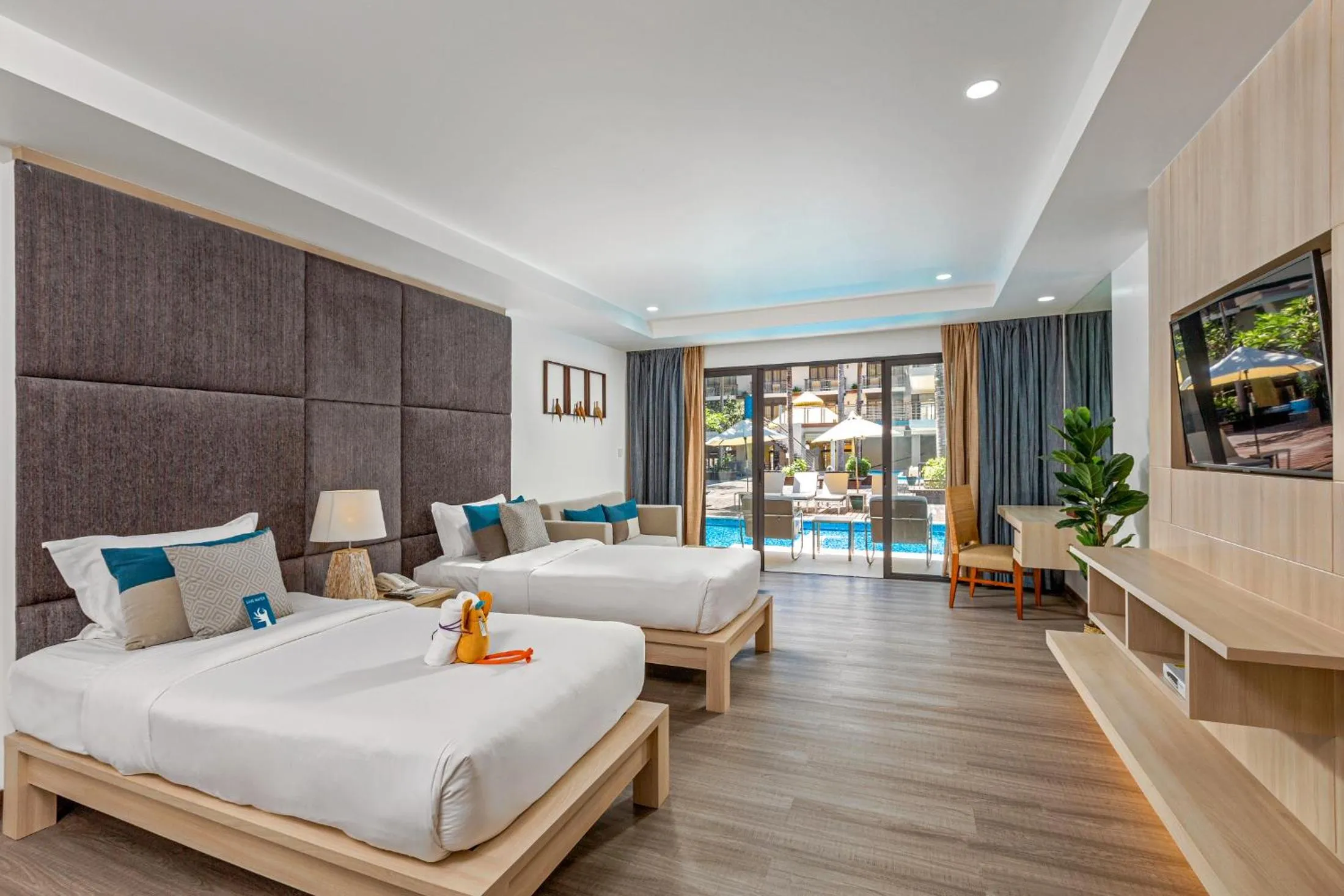 Photo of the whole room, Bed in Baan Laimai Beach Resort & Spa - SHA Extra Plus