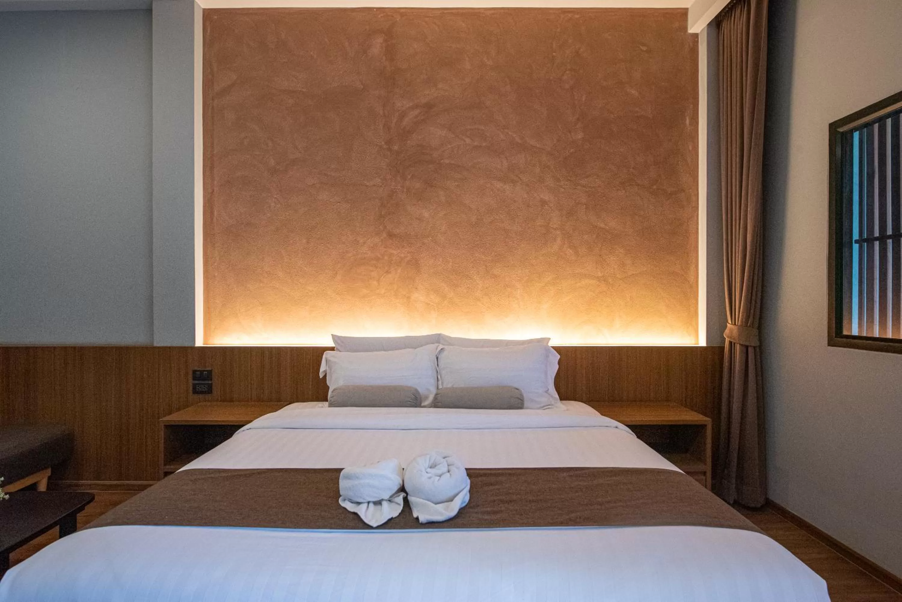 Bed in Tarnsiri Boutique Resort