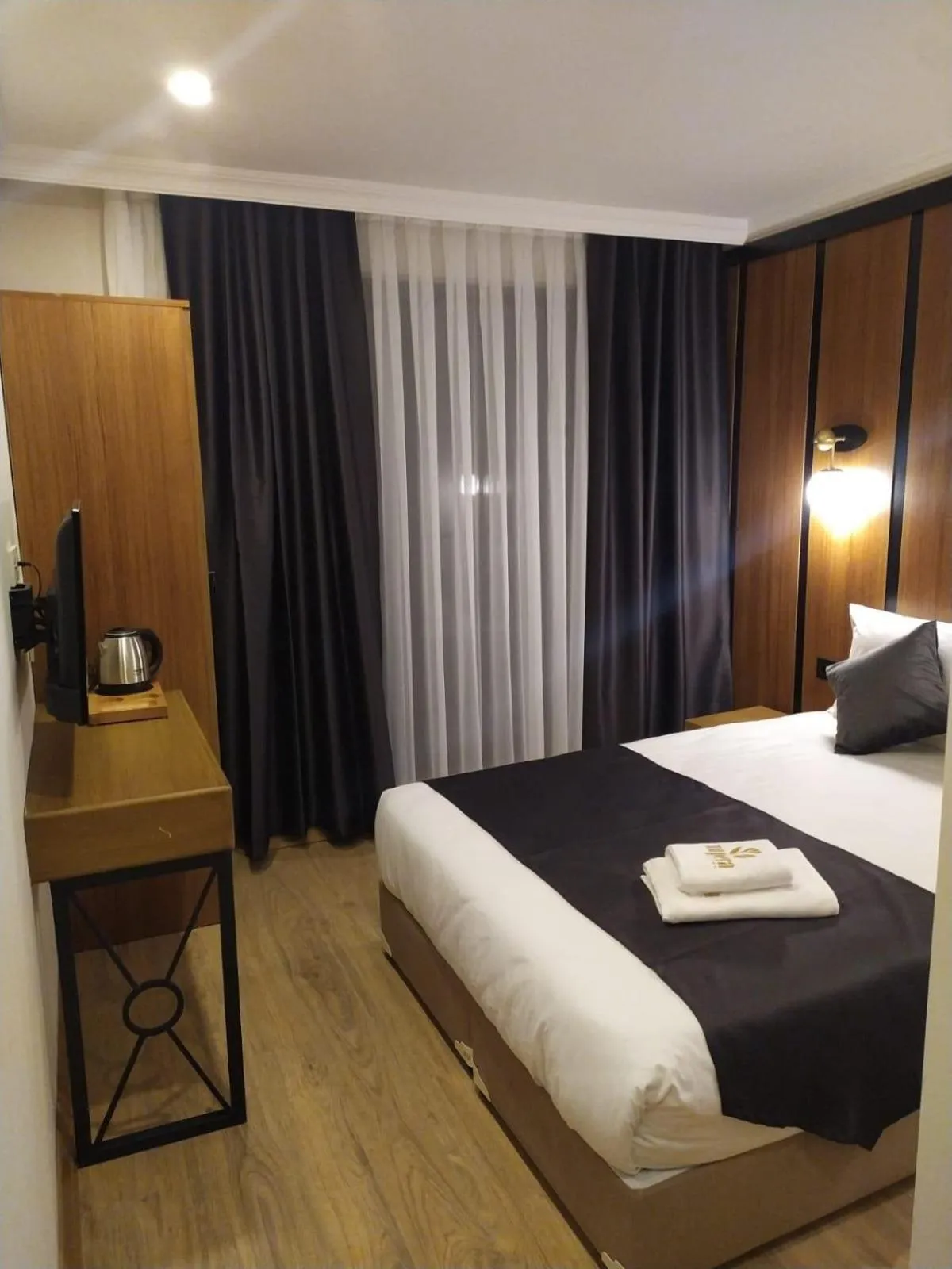 Bed in NUPERA HOTEL