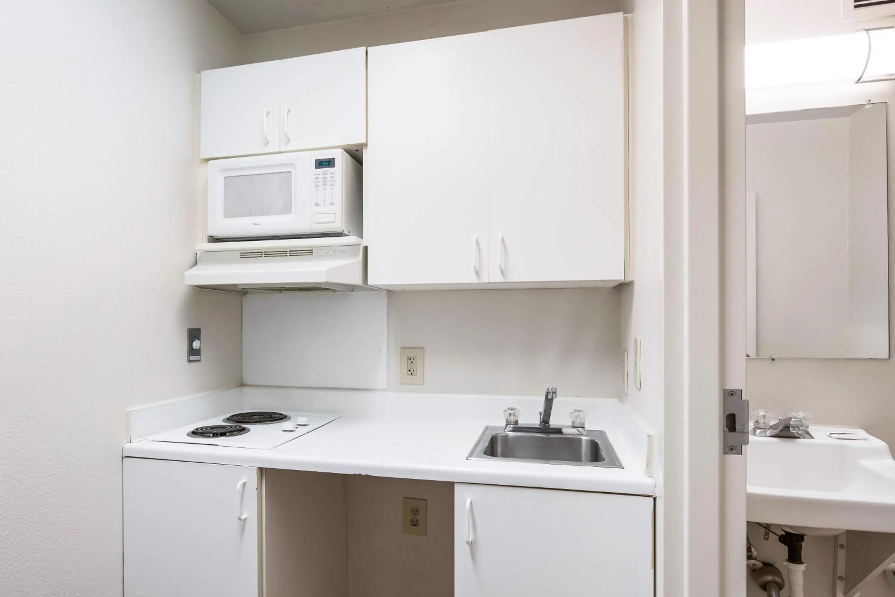 Photo of the whole room in HomeTowne Studios by Red Roof Colorado Springs - Airport