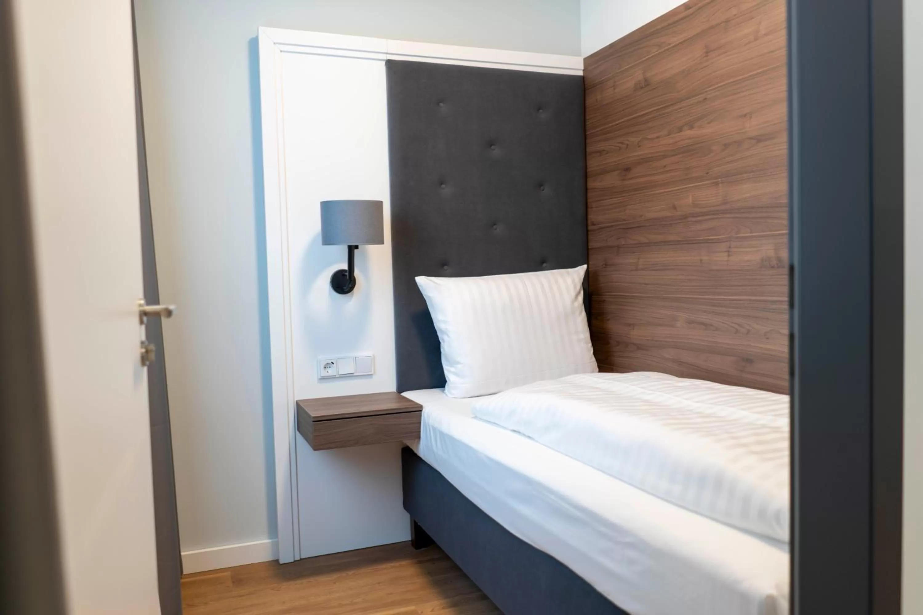 Bed in Signature Hotel Skarv