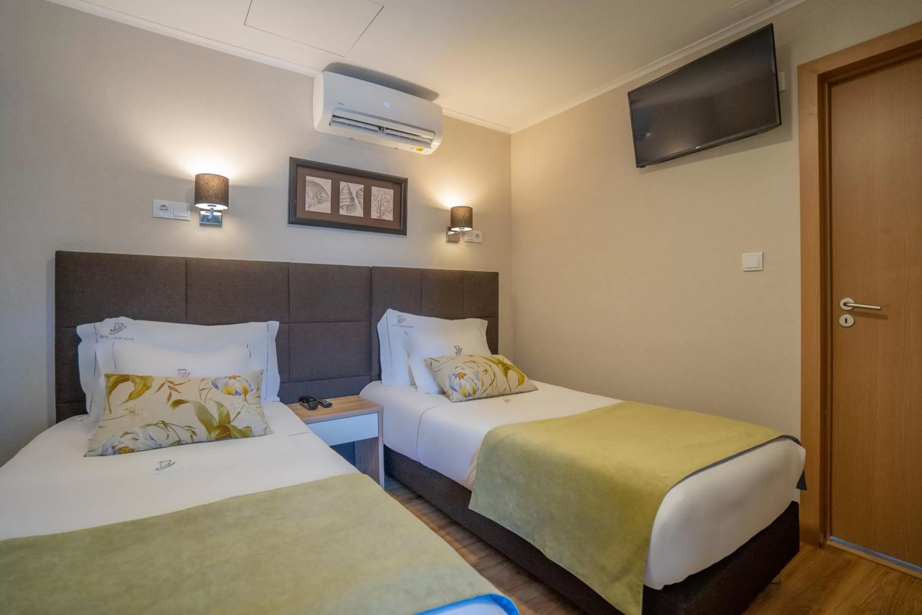 Bed in Dinya Lisbon Hotel