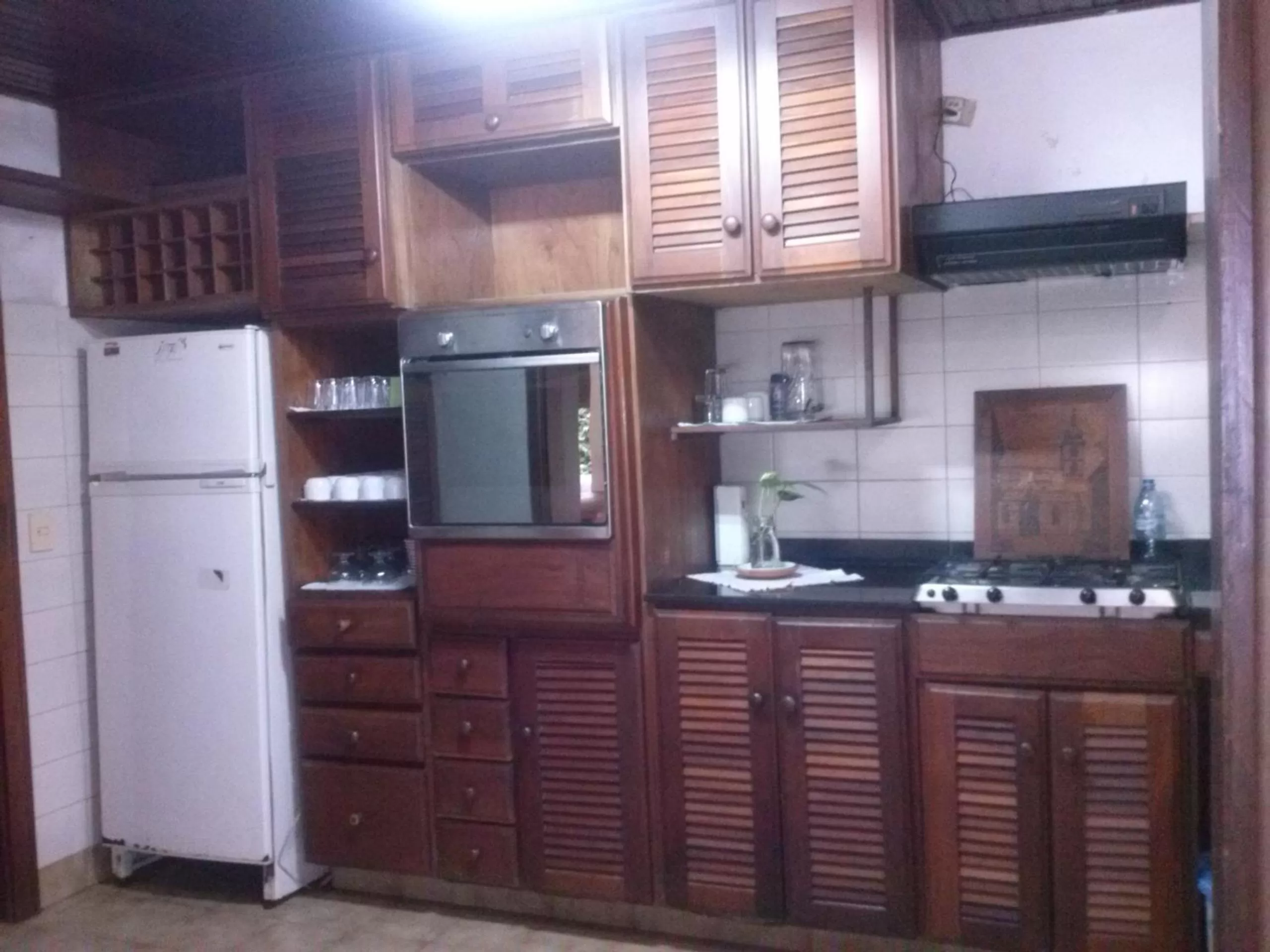 Kitchen or kitchenette in Petit Hotel Caraguata