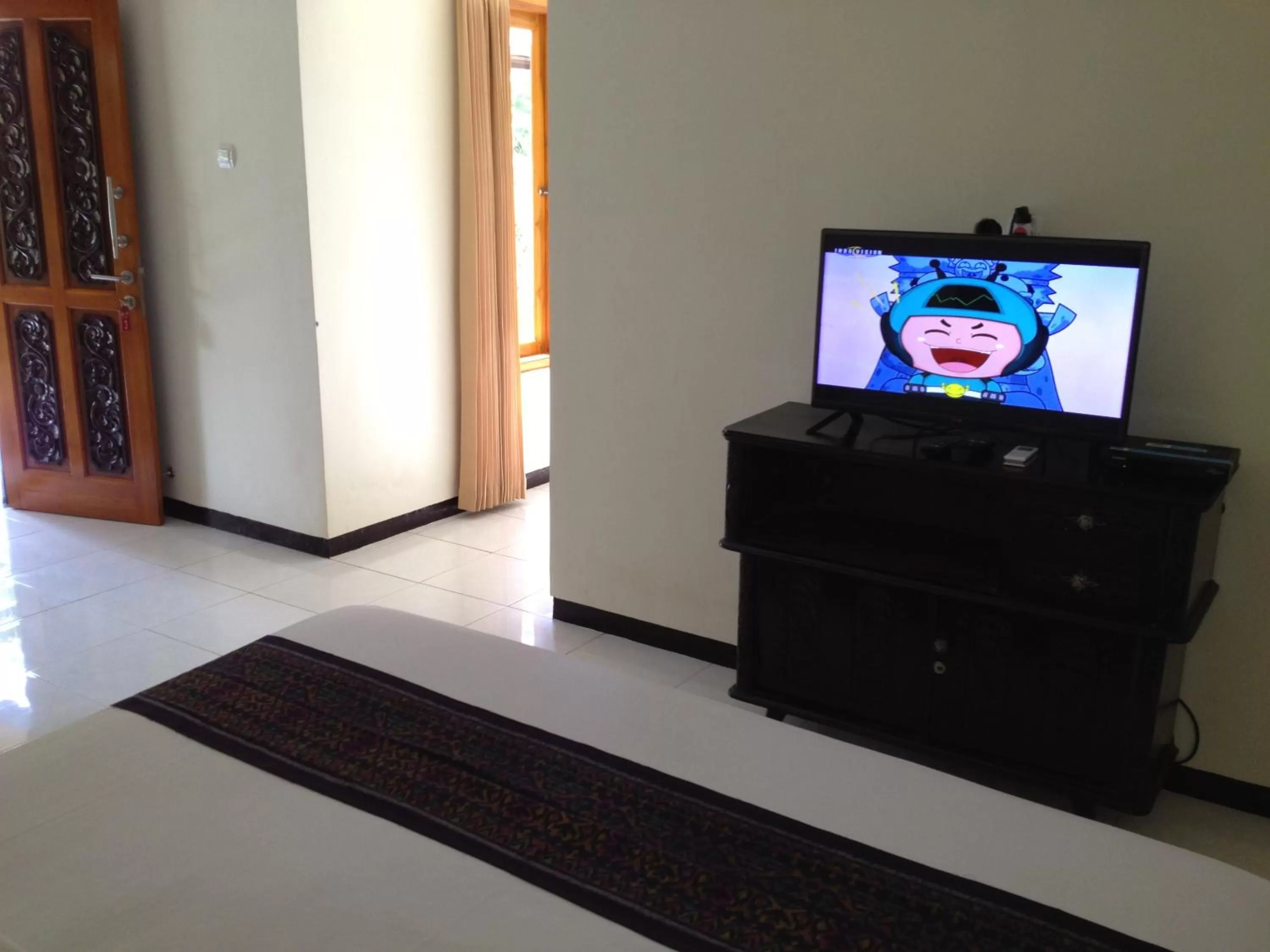 Bedroom, TV/Entertainment Center in Astina Hotel