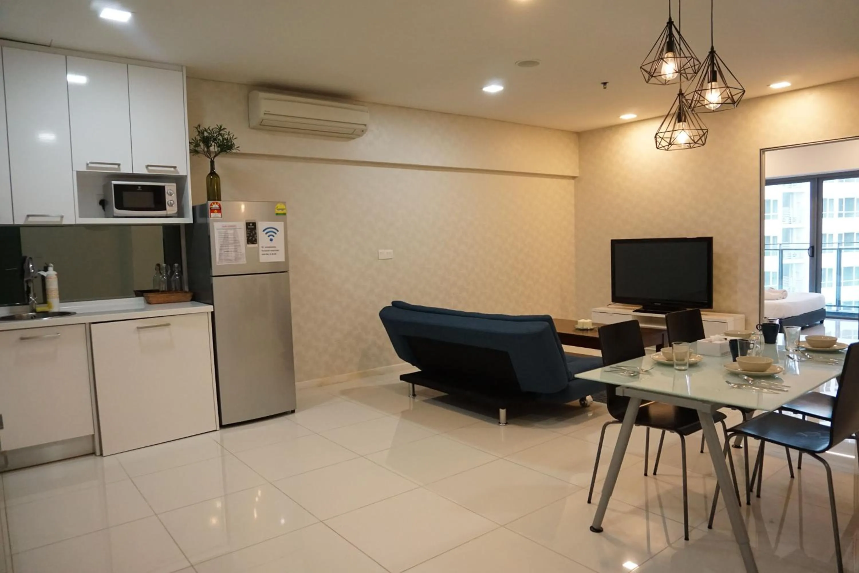 Living room, Kitchen/Kitchenette in Mercu Summer Suite KLCC @ Penguin Homes