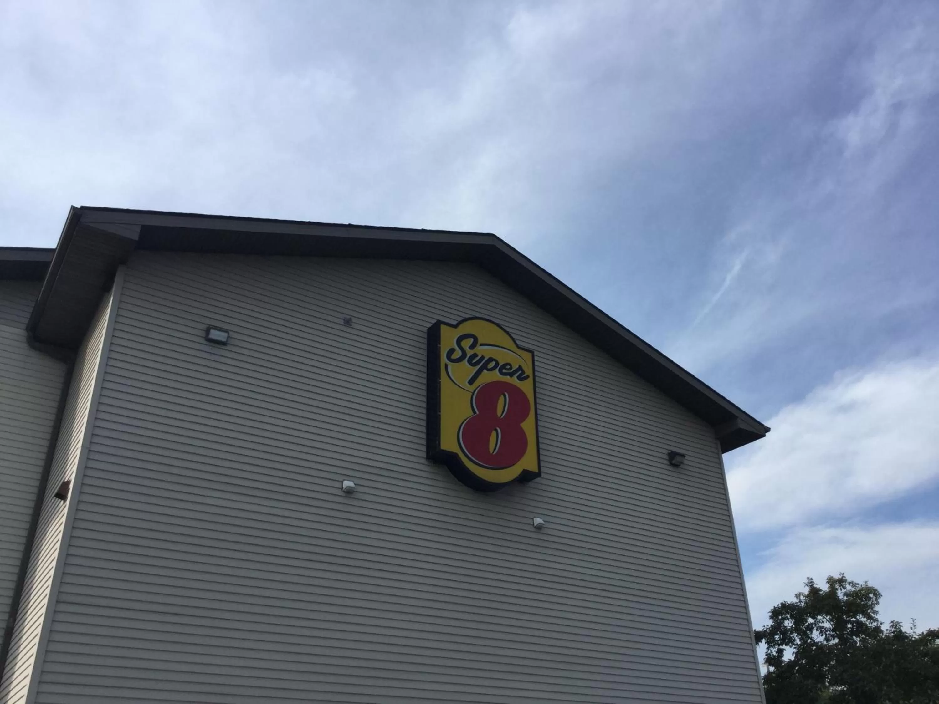 Property logo or sign in Super 8 by Wyndham New Stanton