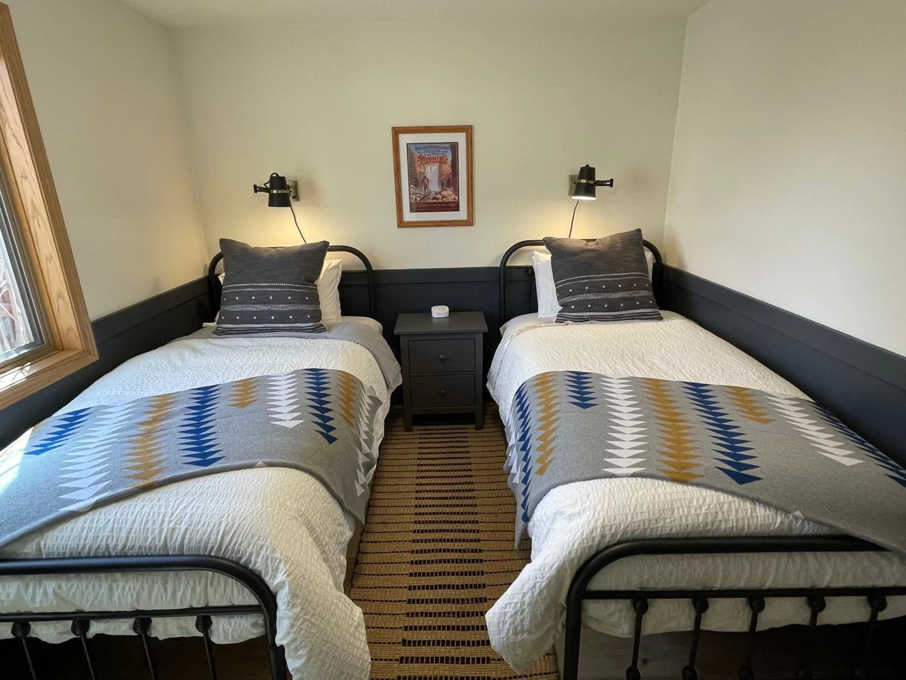 Bed in Pinedale Cozy Cabins