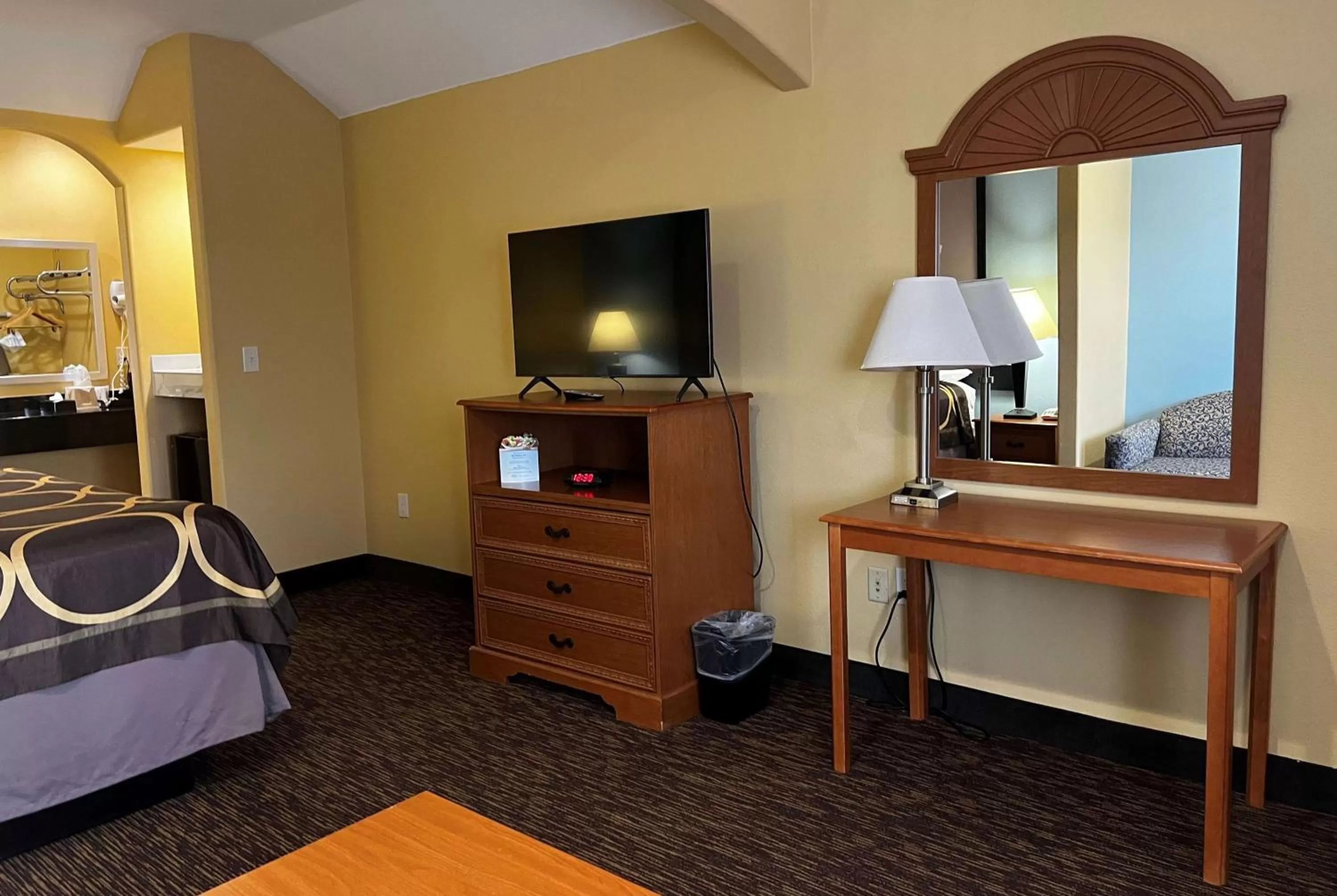 Photo of the whole room, TV/Entertainment Center in Super 8 by Wyndham Montgomery/ Lake Conroe