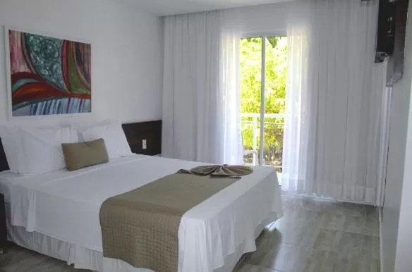 Bed in Pousada Sol e Mar