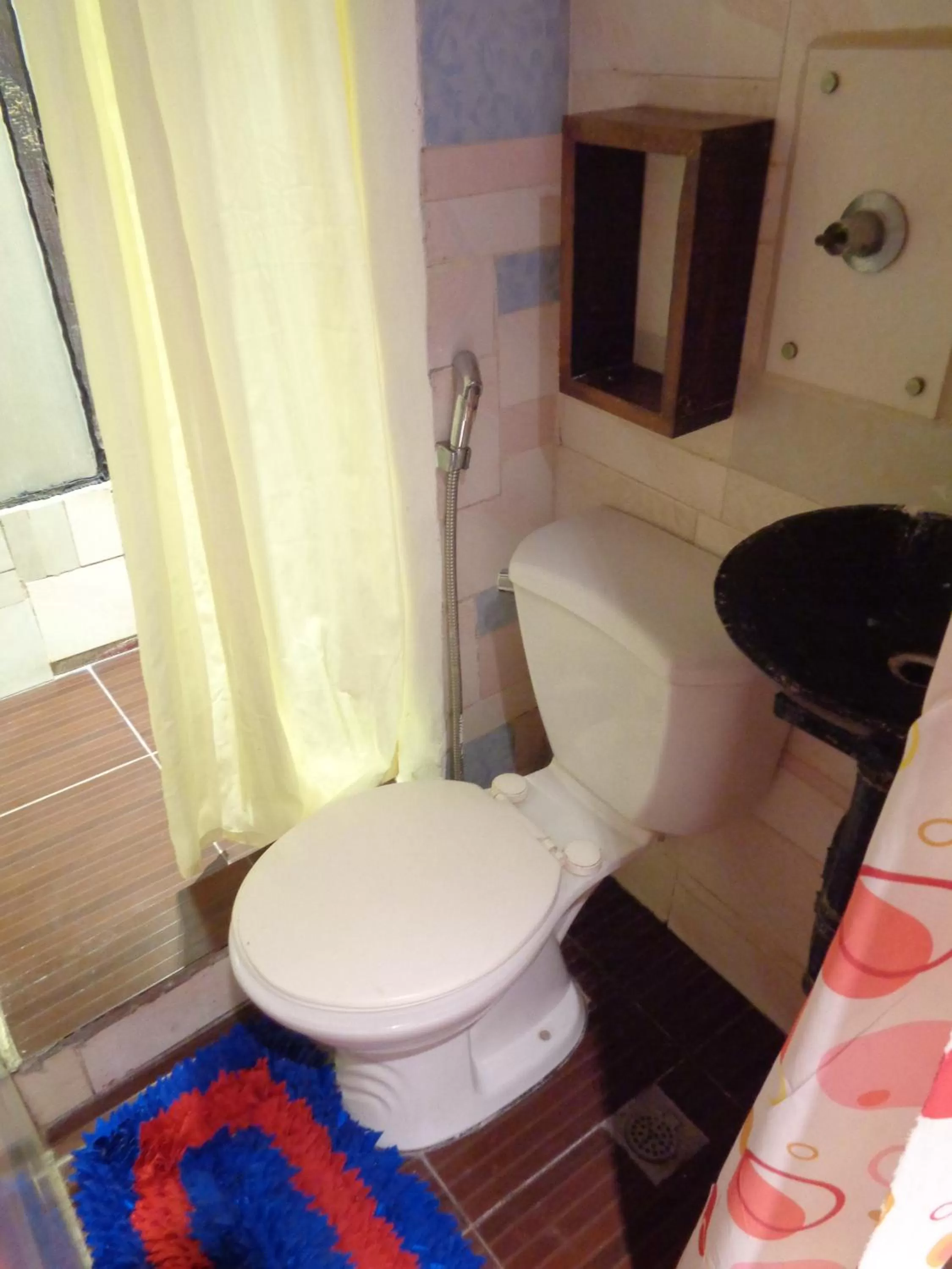 Toilet in Orange Mangrove Pension House by SMS Hospitality