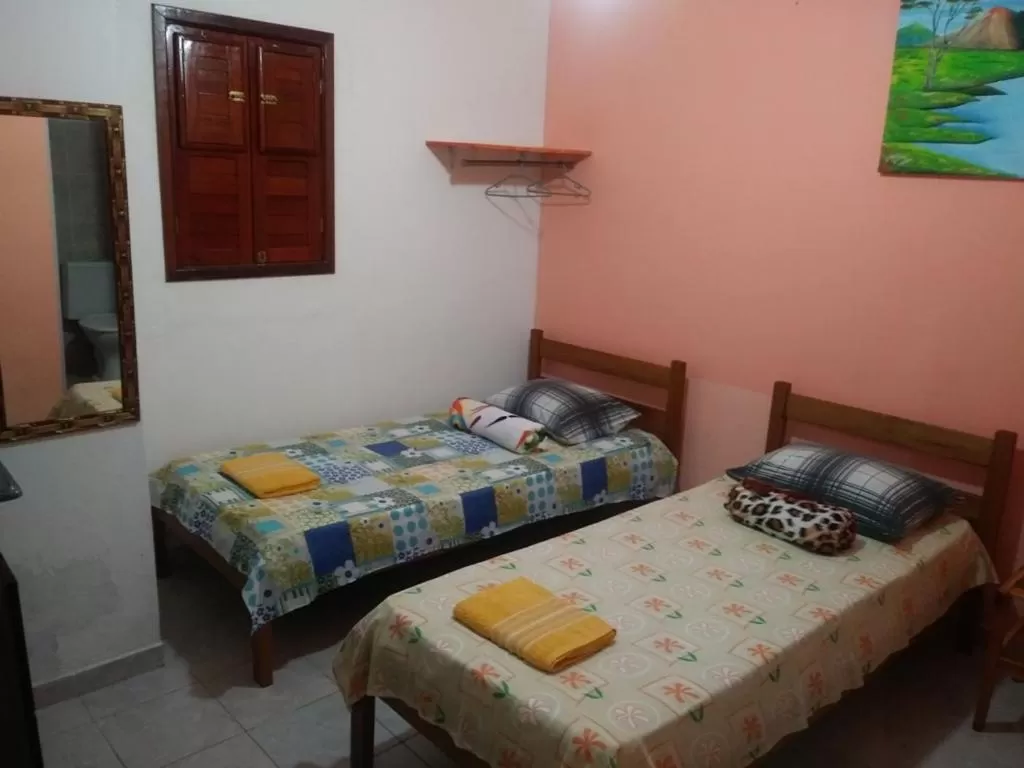 Bed in Pousada dos Ventos