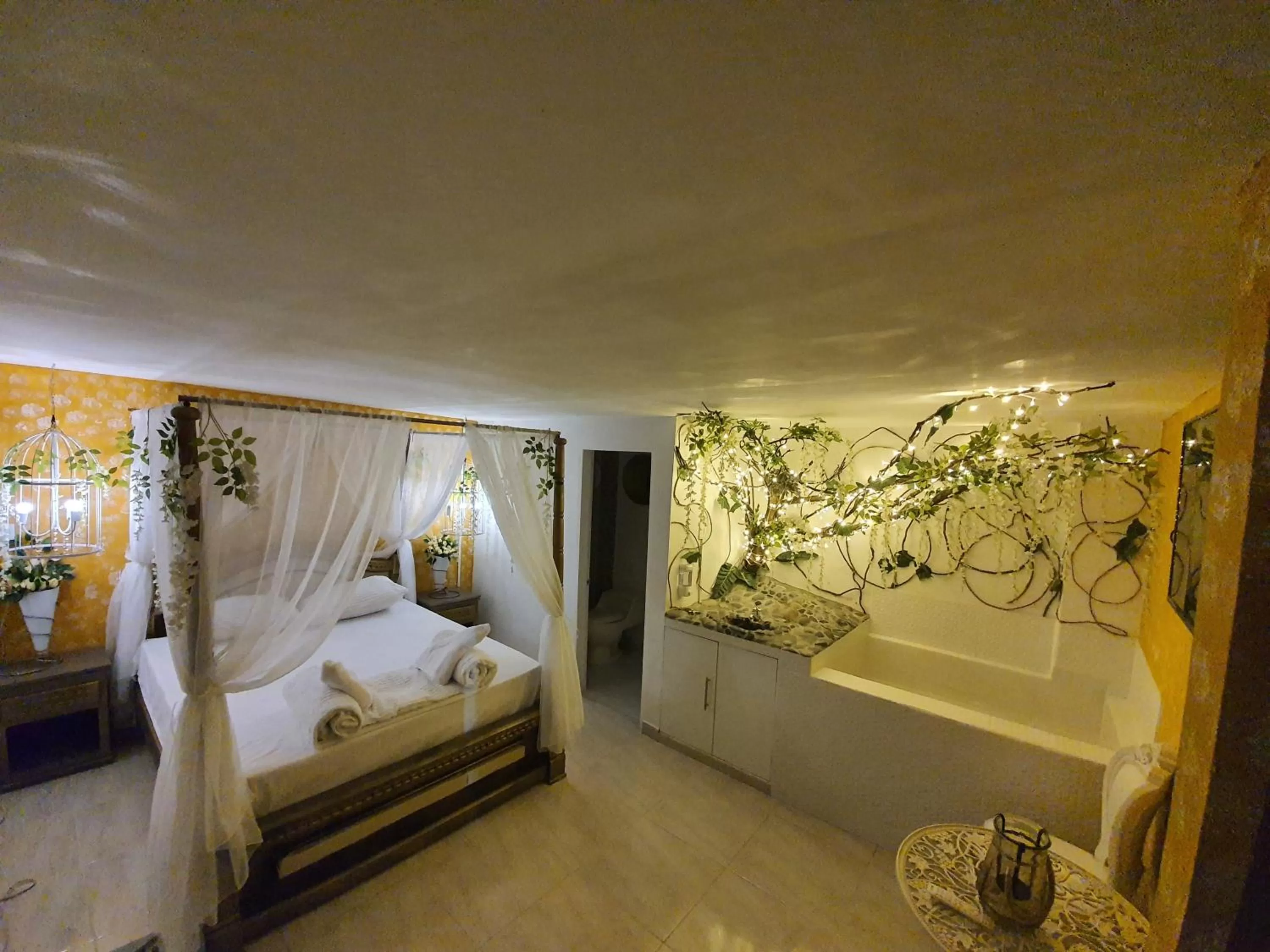 Bed in HOTEL BOUTIQUE EL FARO BY AROMAX