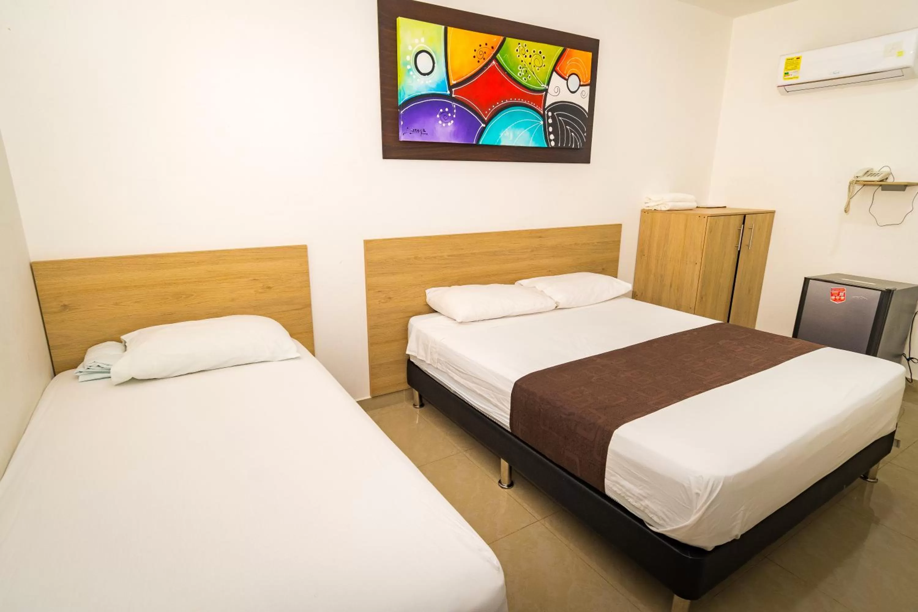 Bed in Genesis Hotel