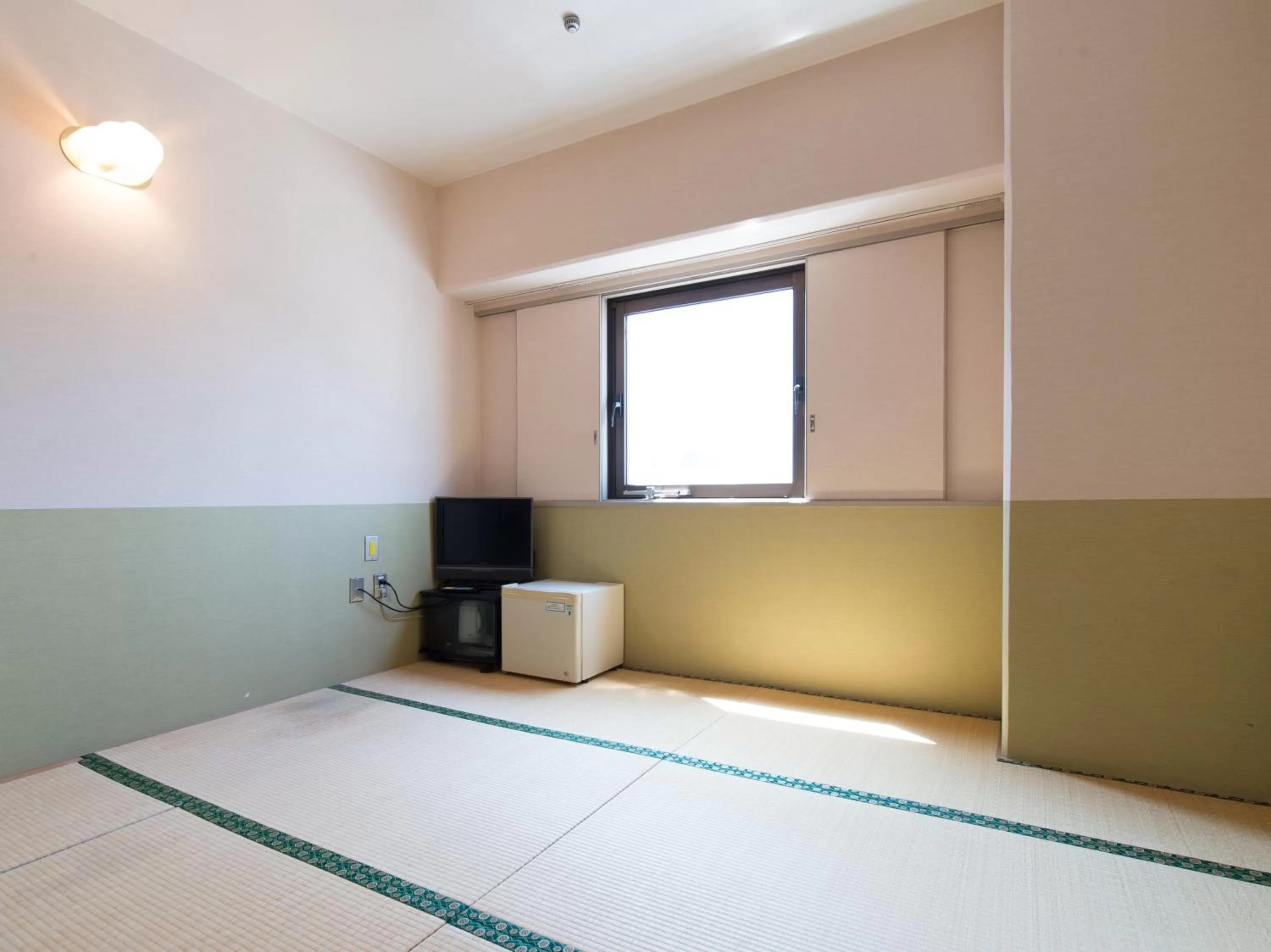 Photo of the whole room, Bed in Tabist Hotel Tetora Kitakyushu