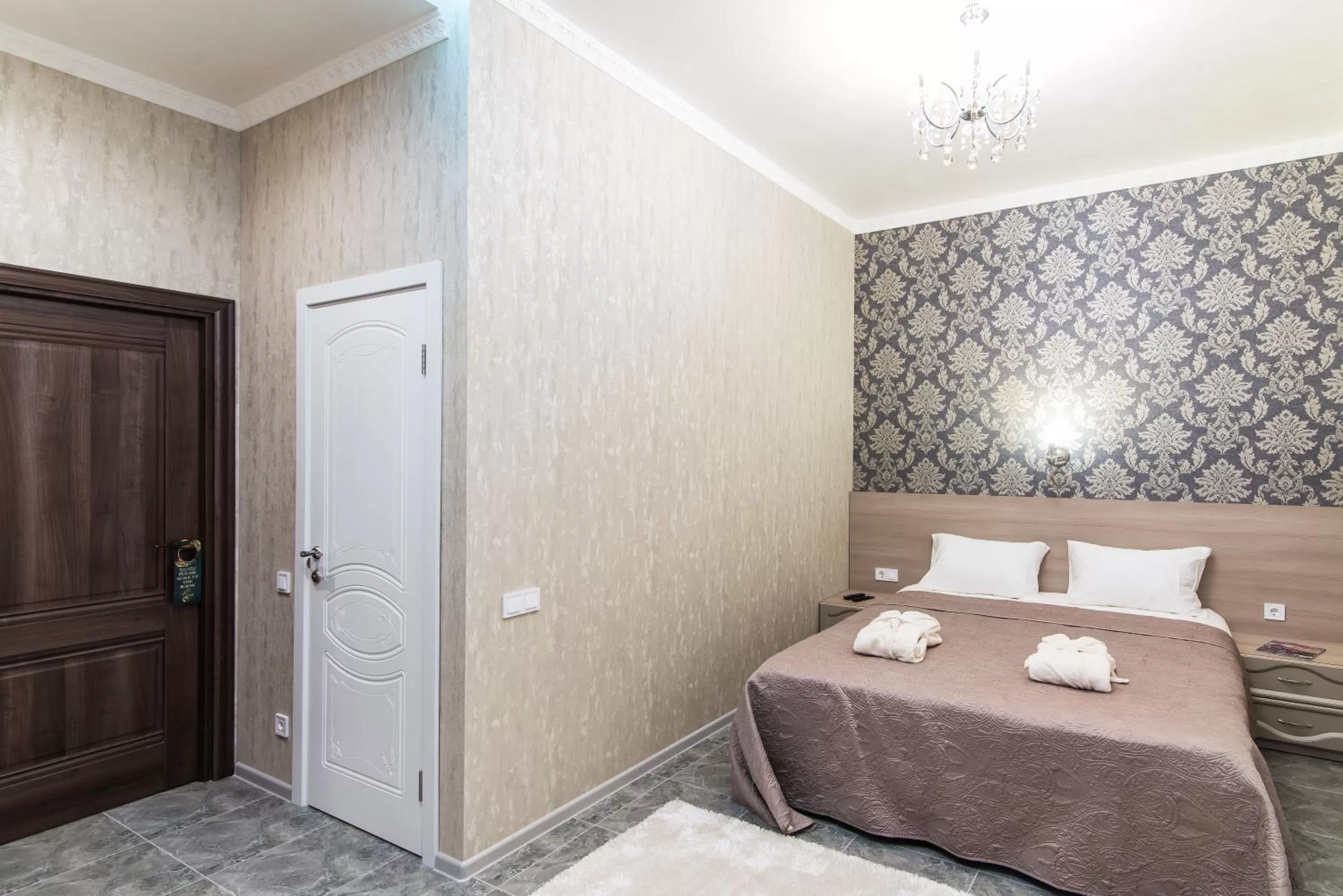 Bed in L.O.Y Family Hotel