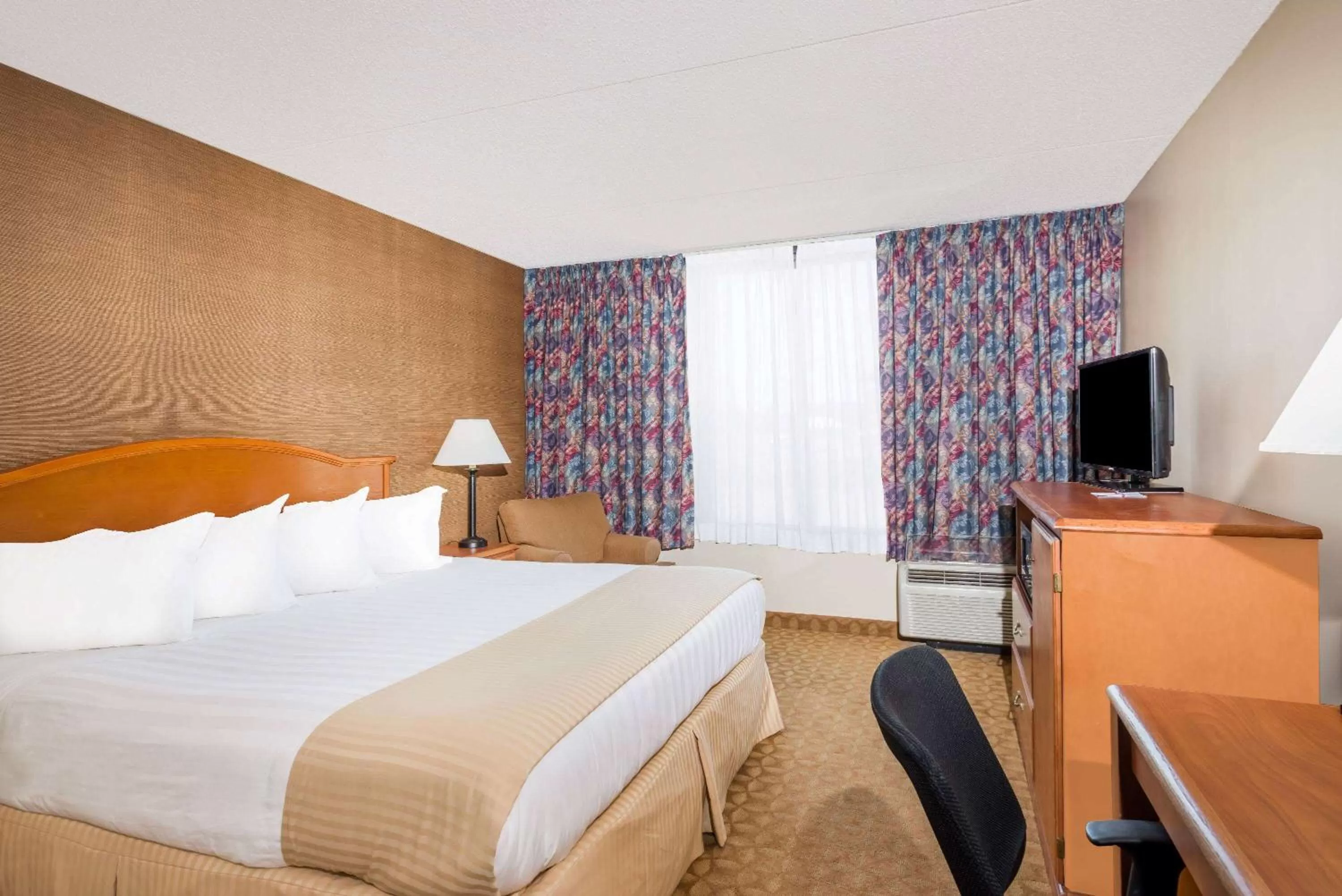 Bed in Ramada by Wyndham Watertown Thousand