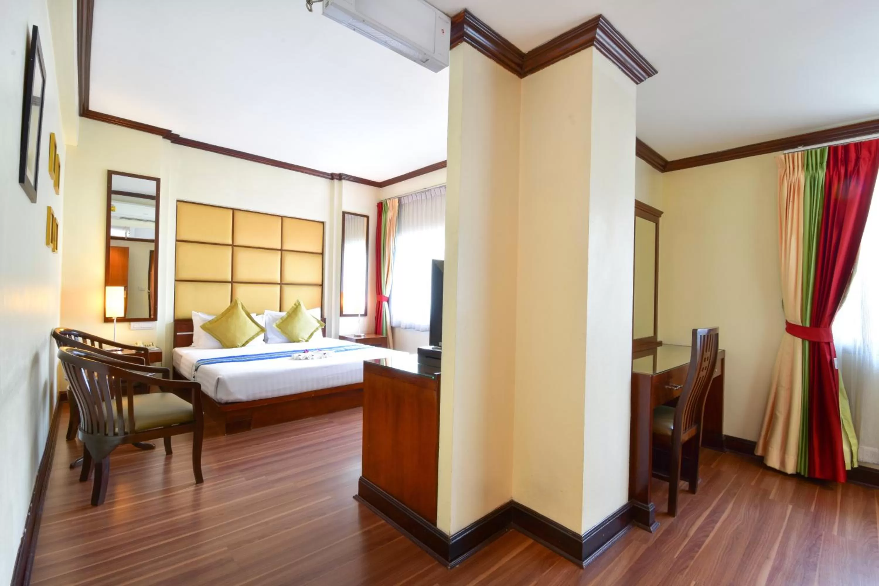 Seating area, Bed in Grand Business Inn