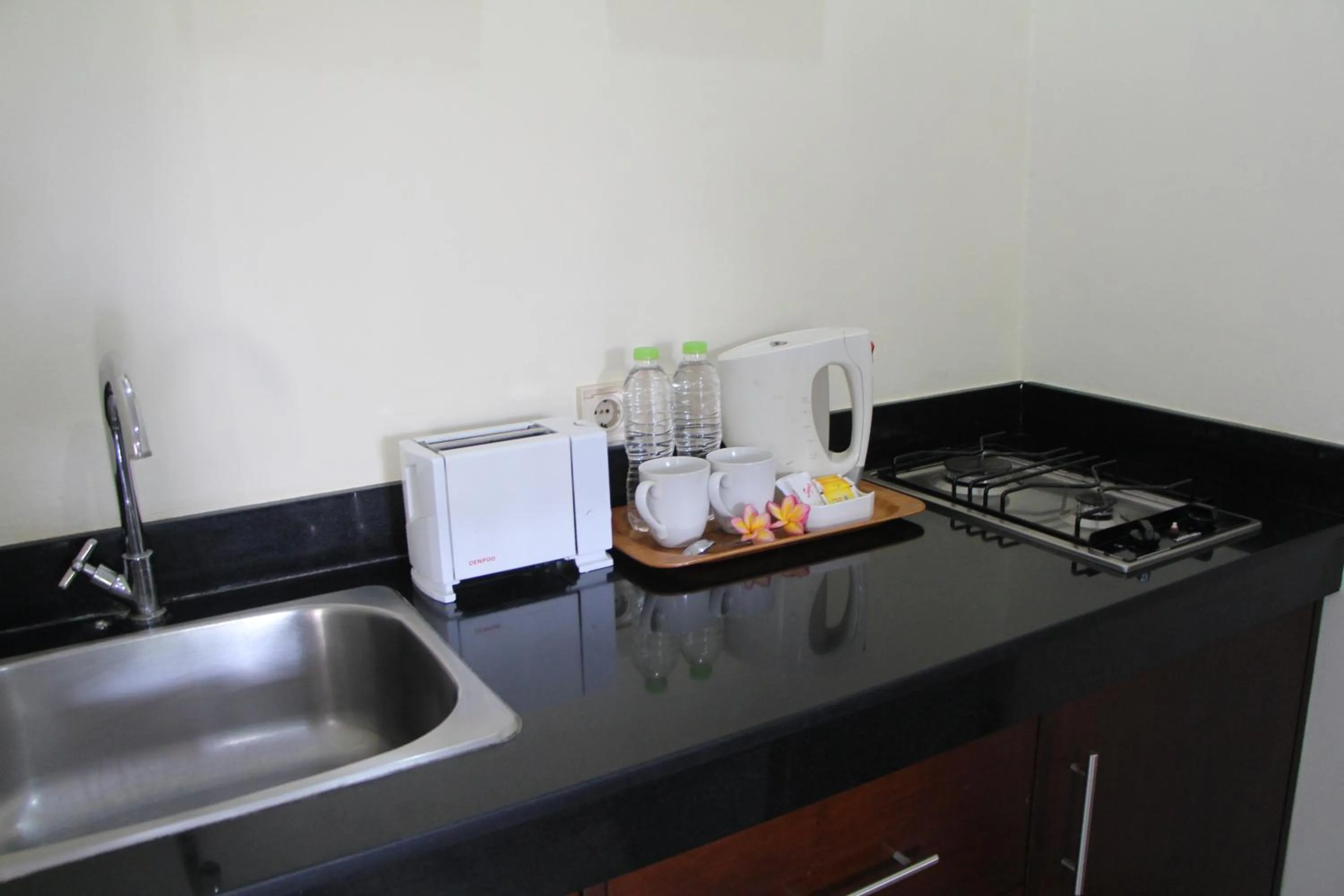 Kitchen or kitchenette in Sekuta Condo Suites