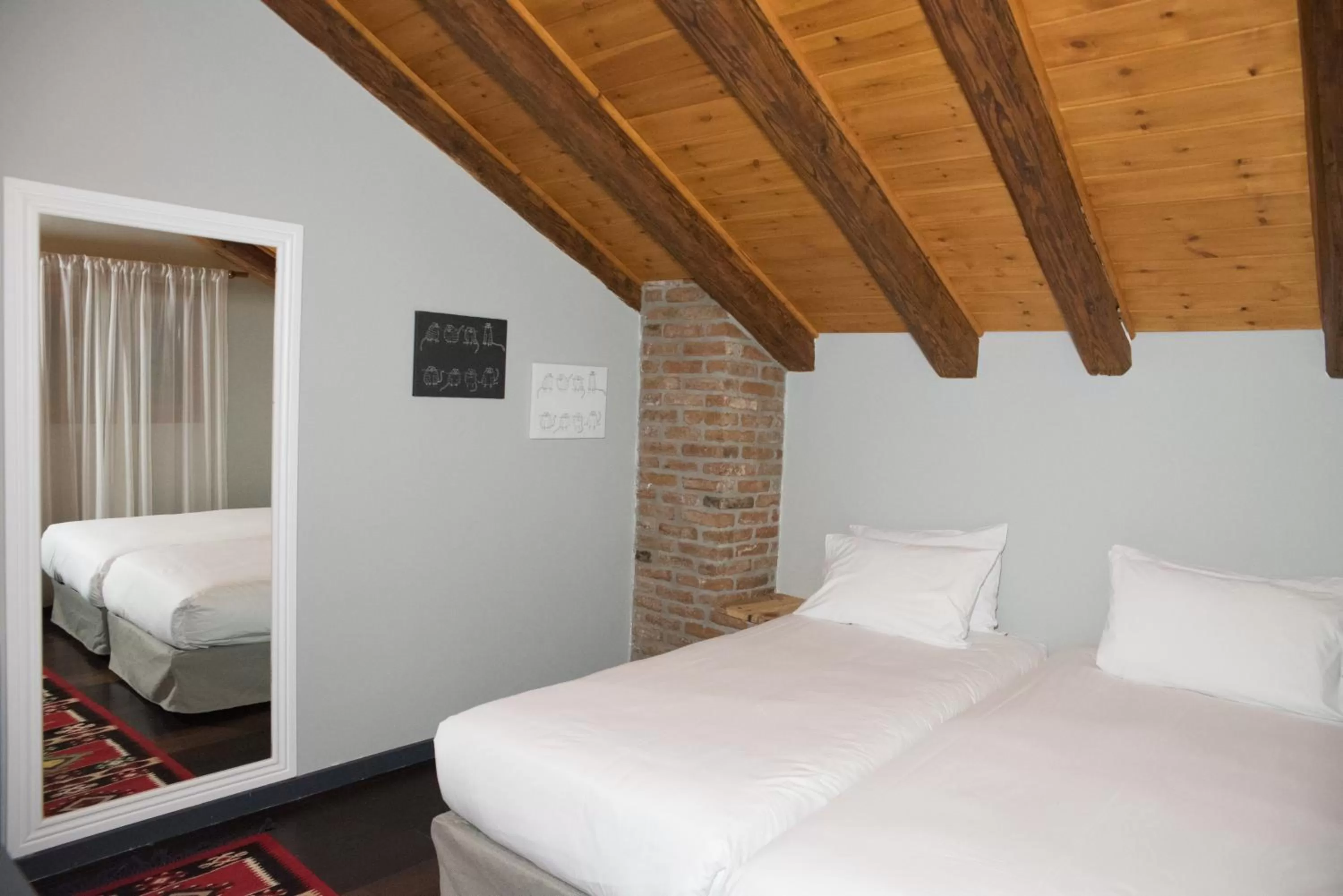 Bed in Dim's Hotel & Restaurant