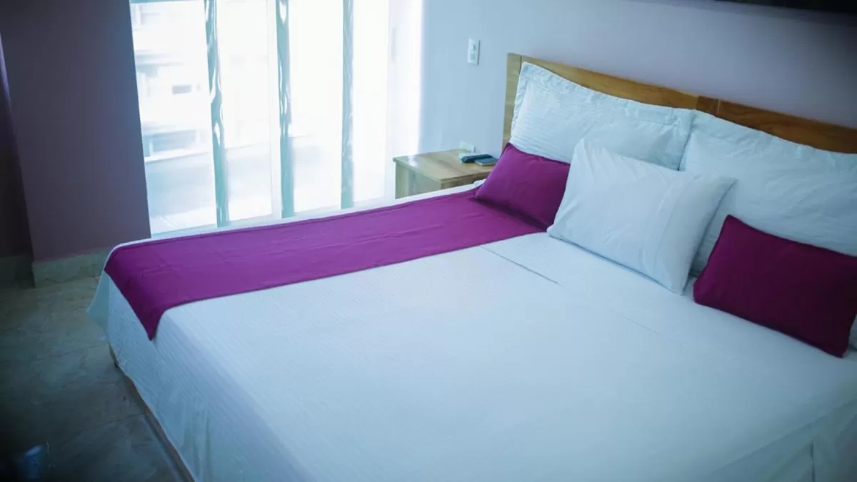 Bed in Kamaleb Farallones Hotel