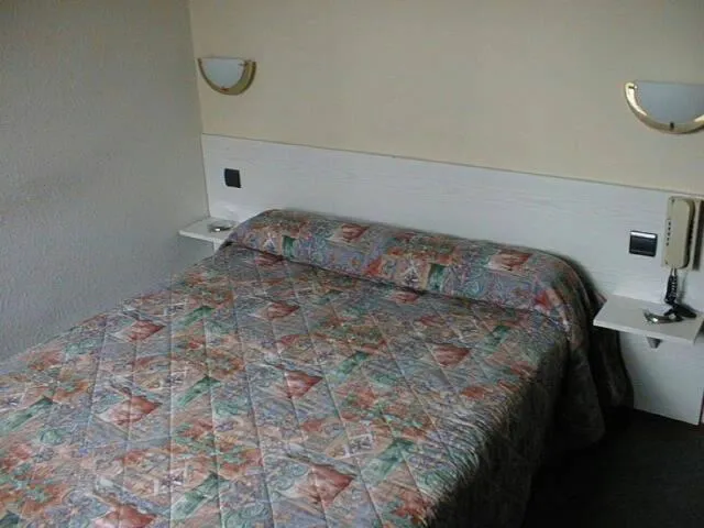 Bed in Hotel Ferney République
