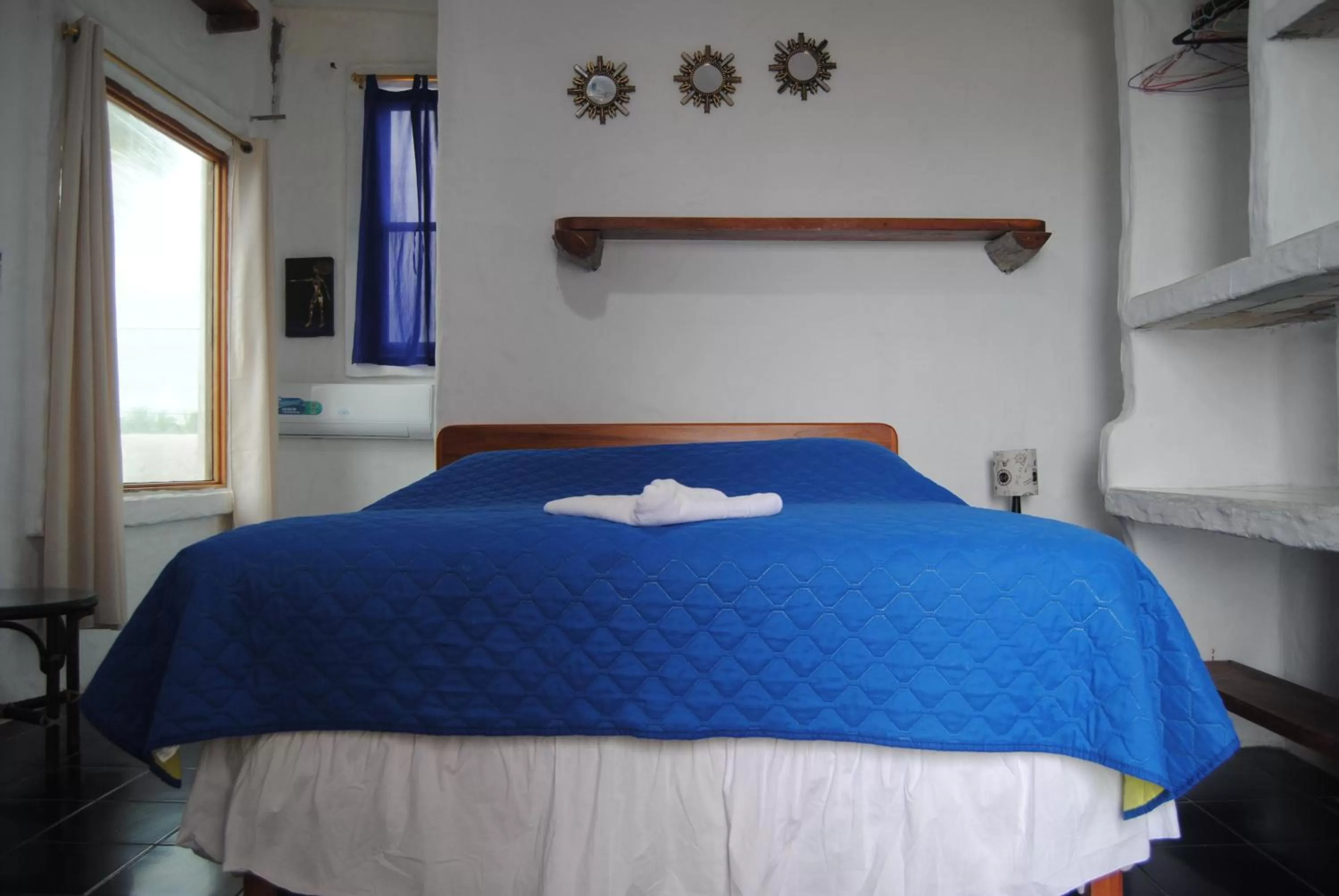 Bed in Hostal Galapagos by Bar de Beto