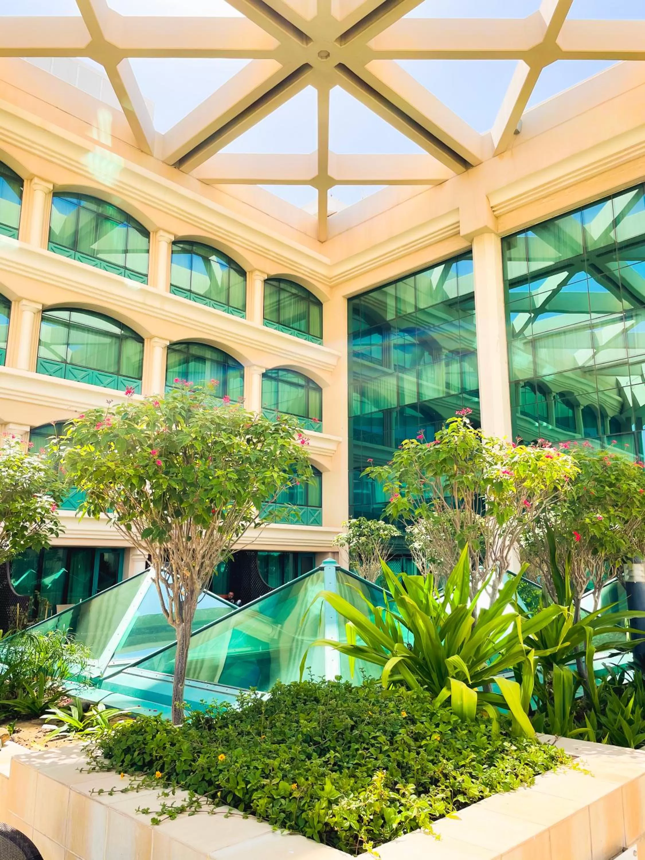 Garden view in Mövenpick Grand Al Bustan