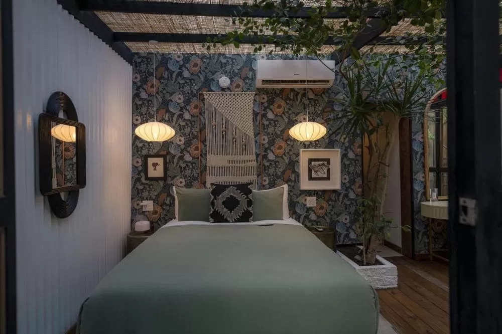 Bed in La Botanica Hotel