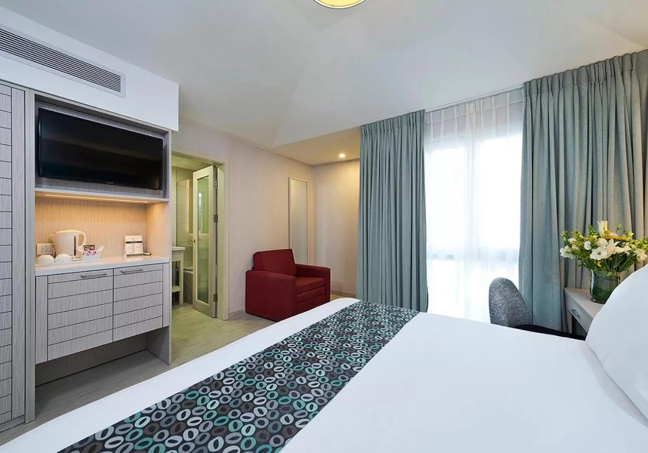 Bed in Astral Village Hotel