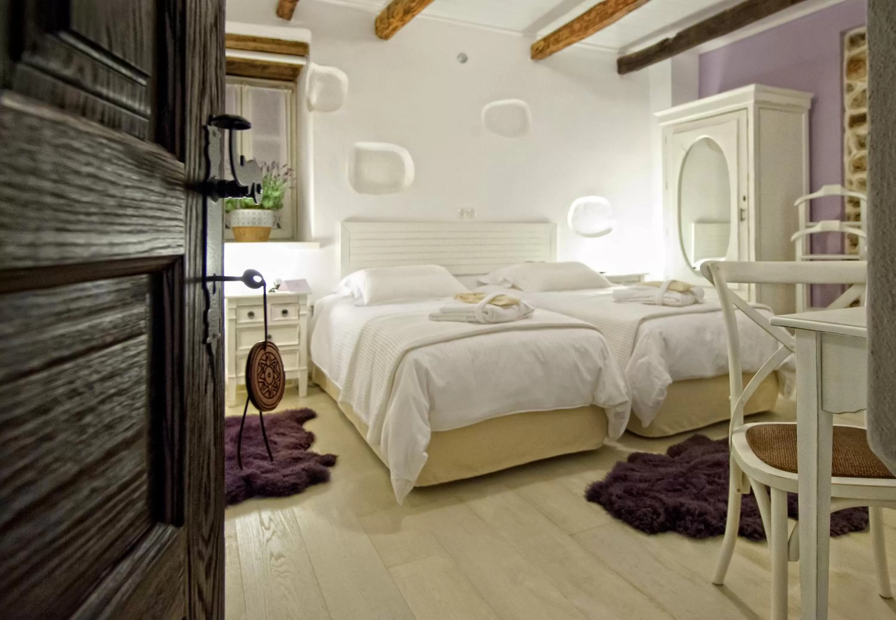 Bed in Orologopoulos Mansion Luxury Hotel