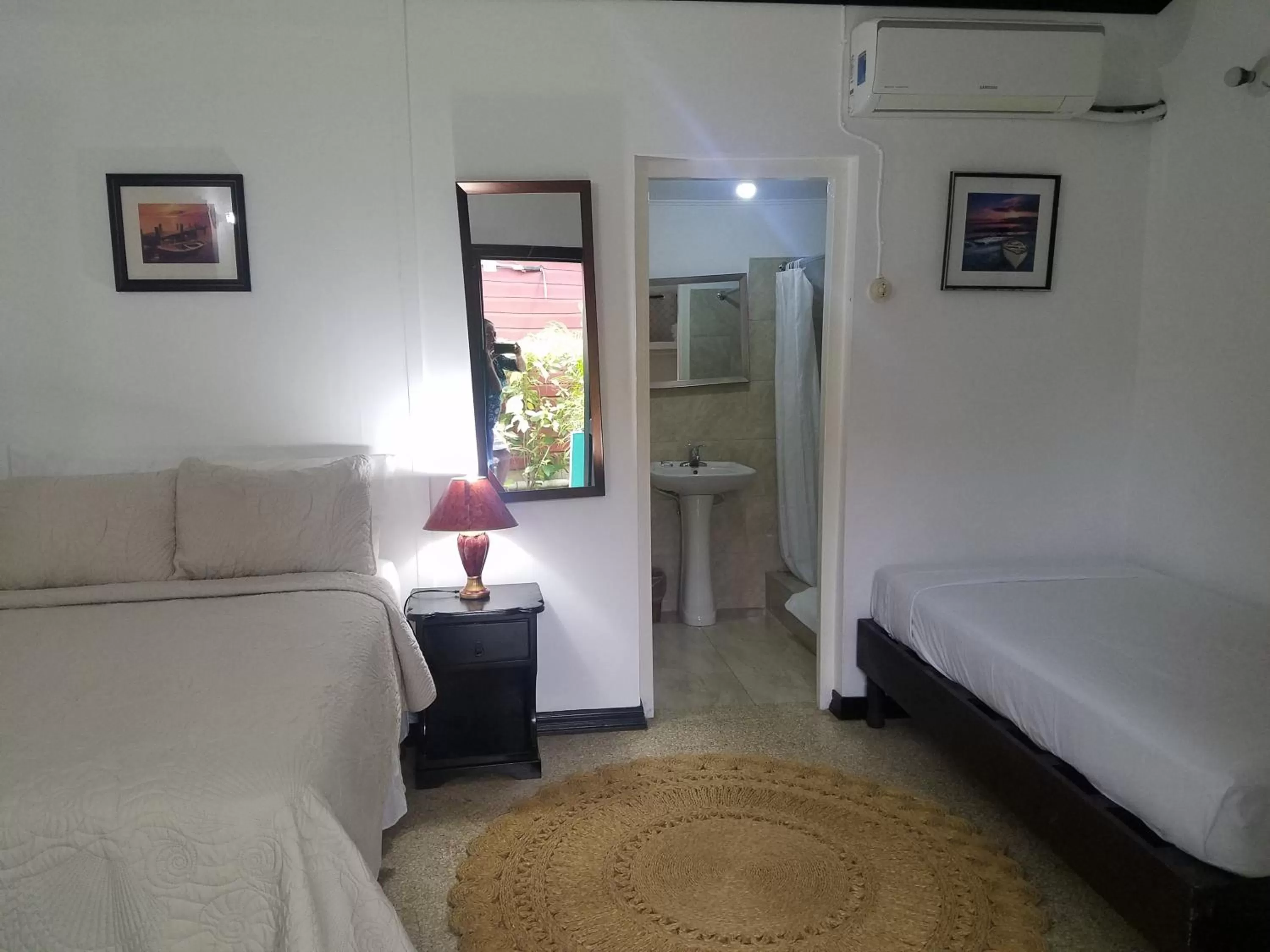 Bed in Roots Cafe Rooms