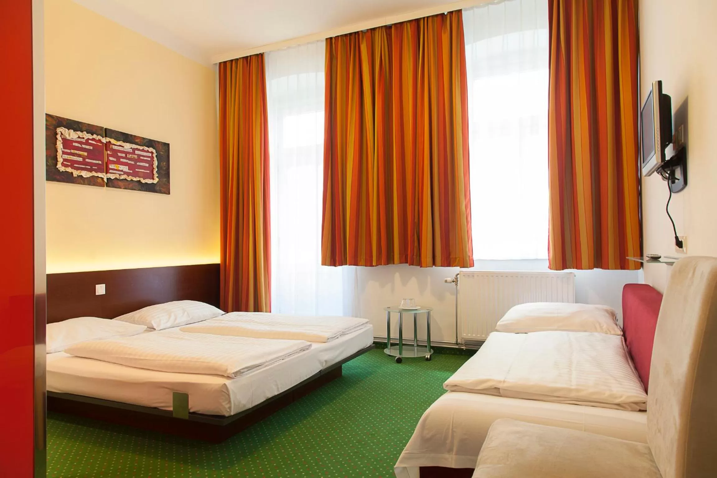 Photo of the whole room, Bed in Pension Stadthalle