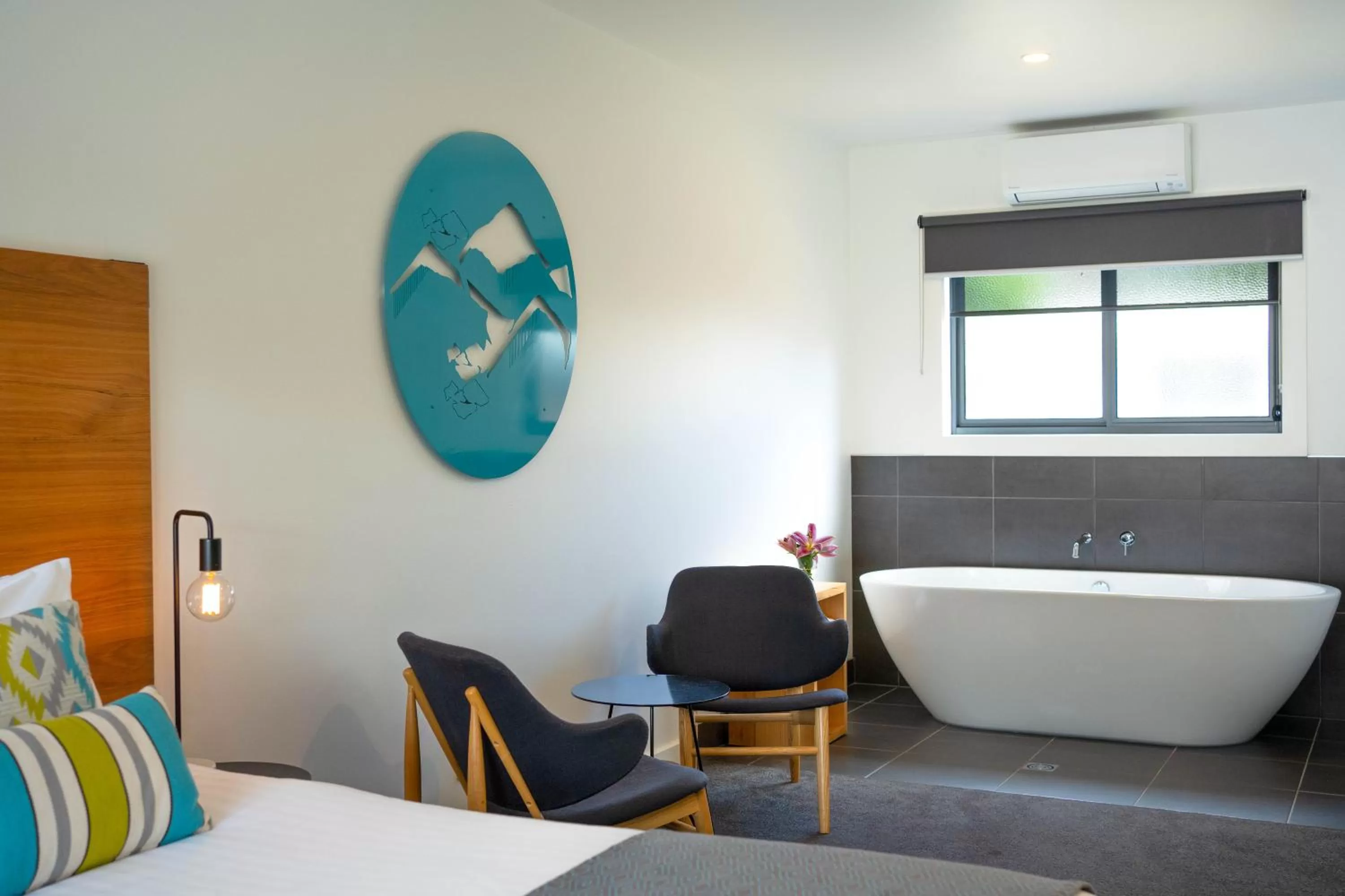 Bed, Seating Area in Bright Colonial Motel