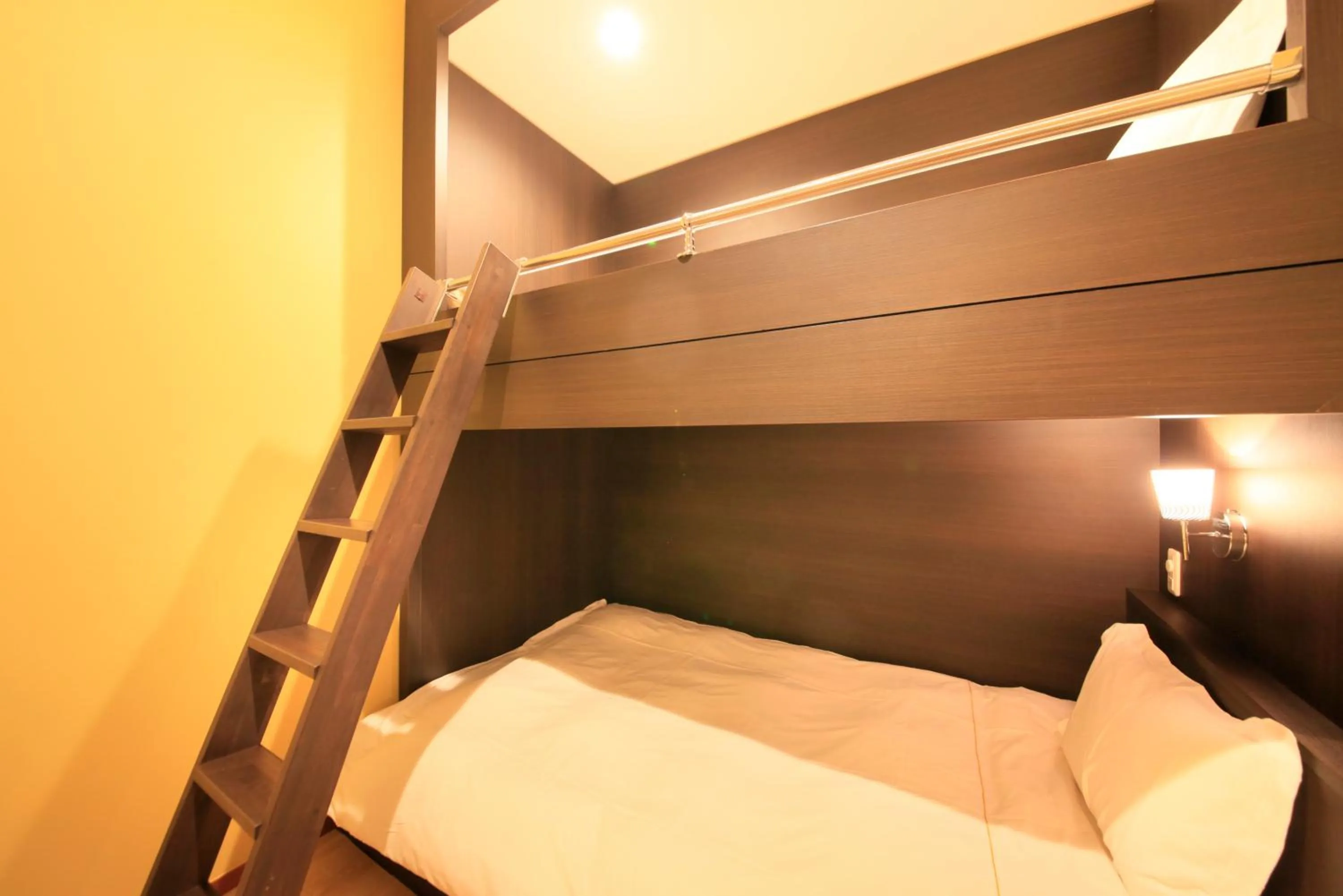 Photo of the whole room, Bed in Centurion Hotel Residential Akasaka Station