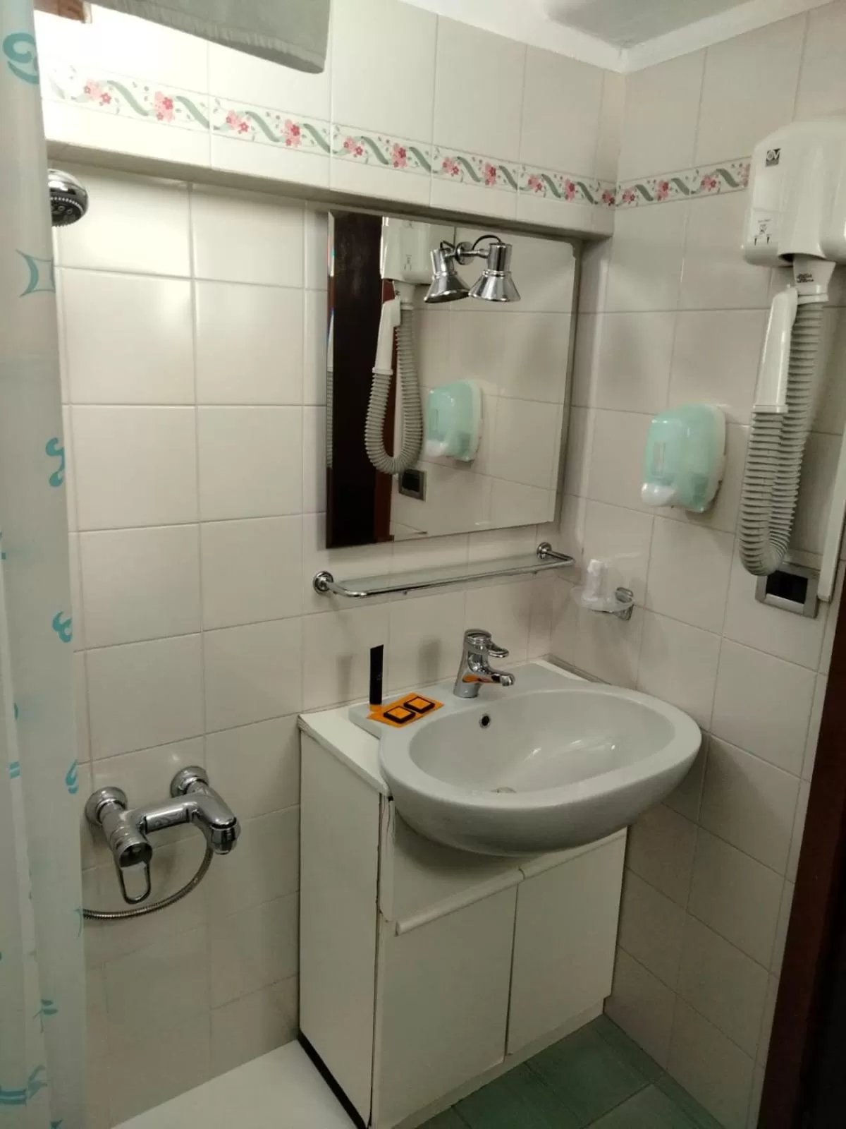 Bathroom in HG Hotel Italia