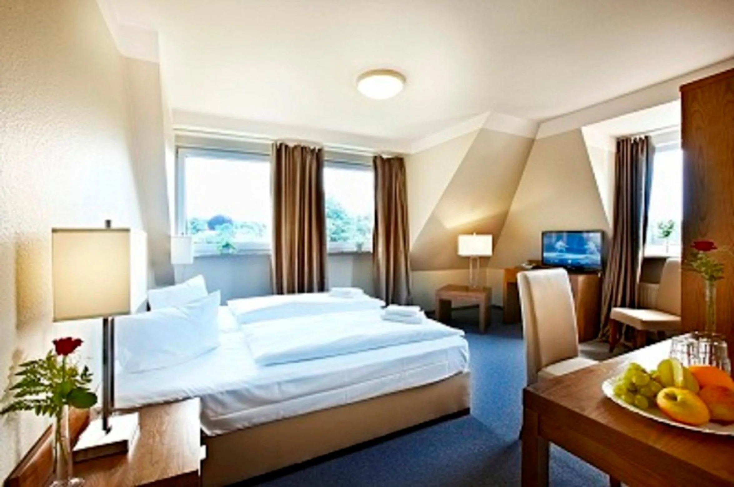 Photo of the whole room, Bed in Hotel Königstein Kiel by Tulip Inn