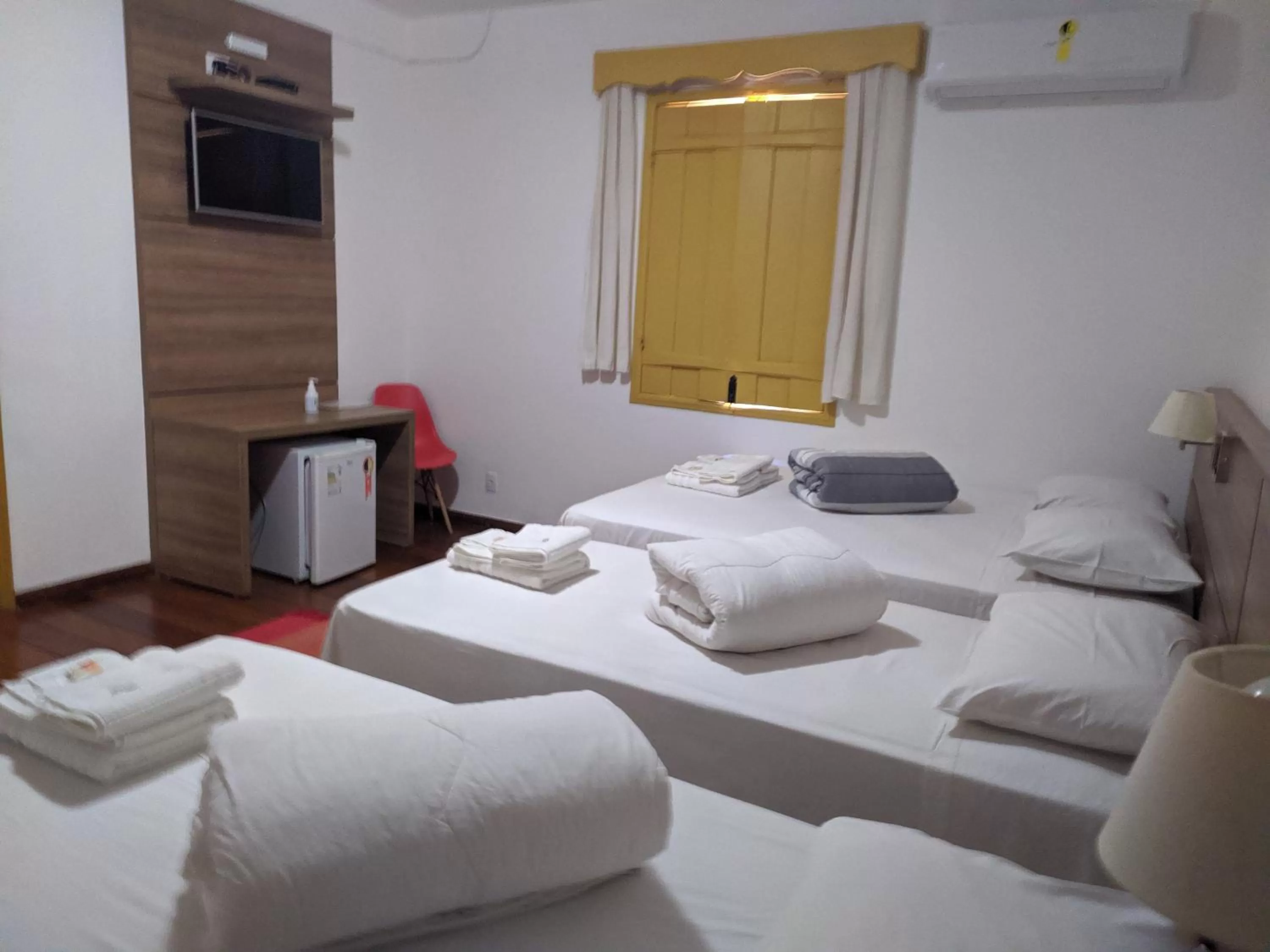 Bed in Pousada o Amanhecer