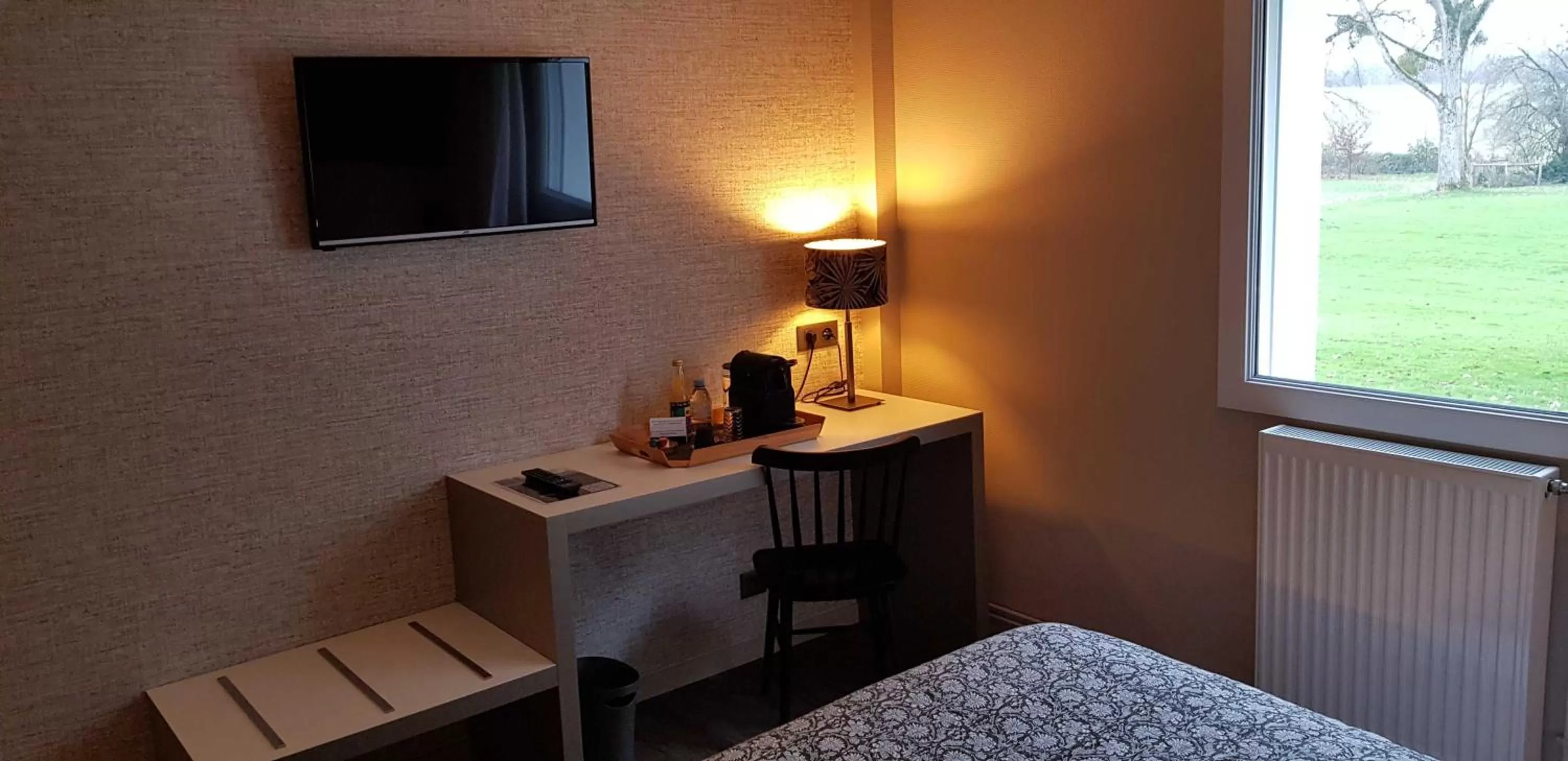 Bedroom in Hôtel le Corbusson