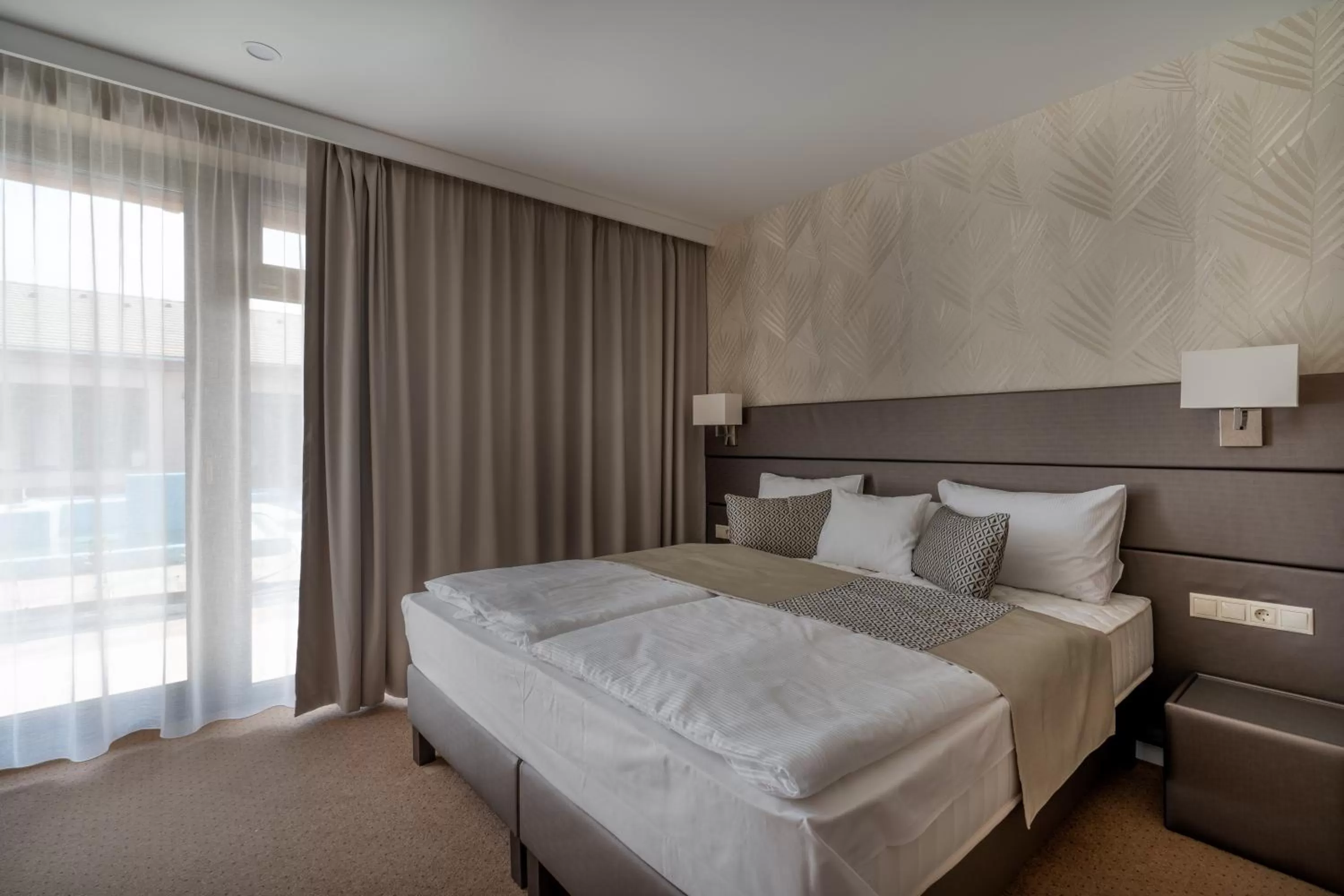 Bed in DorEsz Wellness Panzió